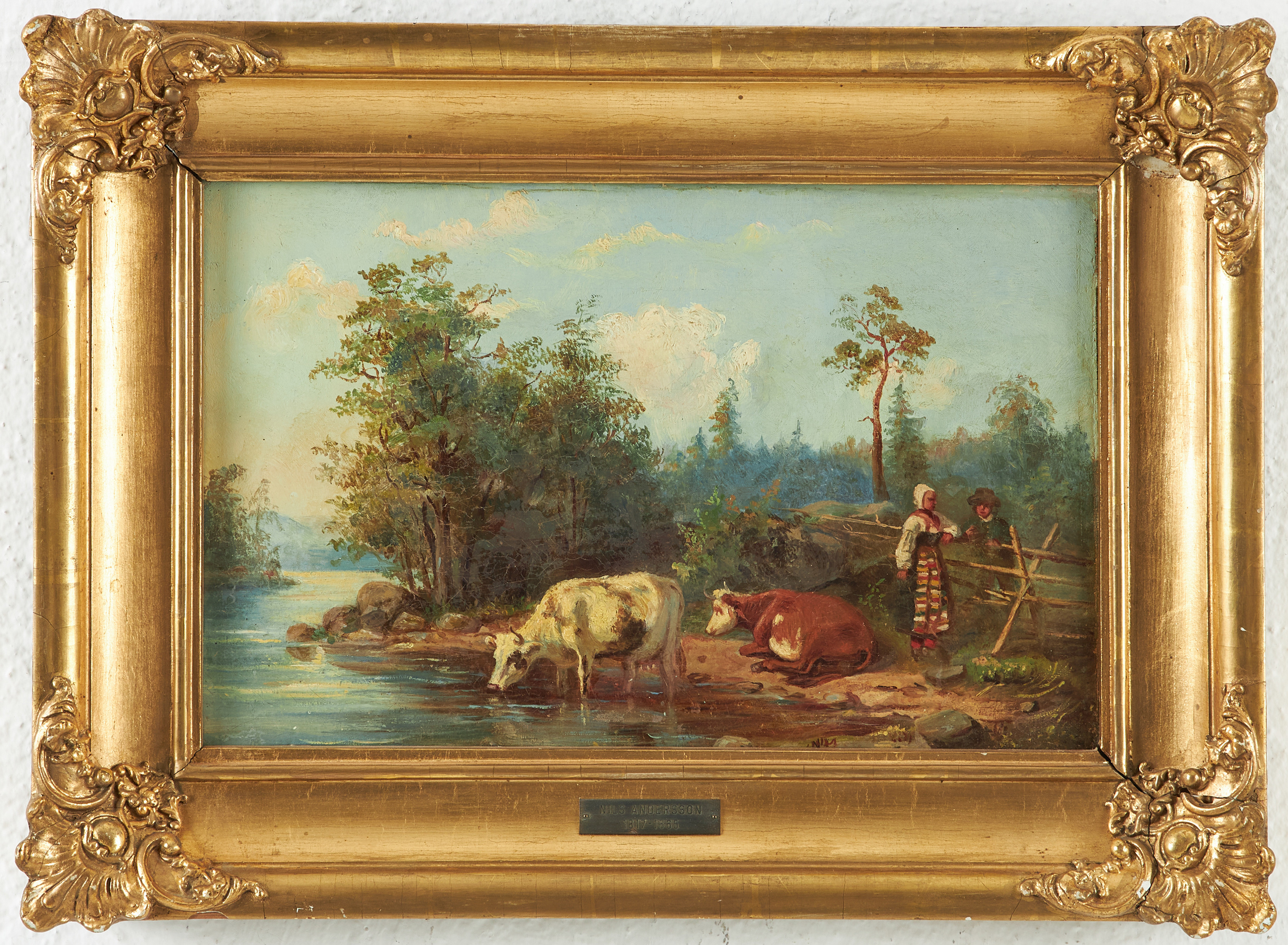 NILS ANDERSSON. TILLSKRIVEN. Landskap med kor vid vattendrag och vallfllicka i allmogedräkt konverserande med en yngling vid en gärdesgård.