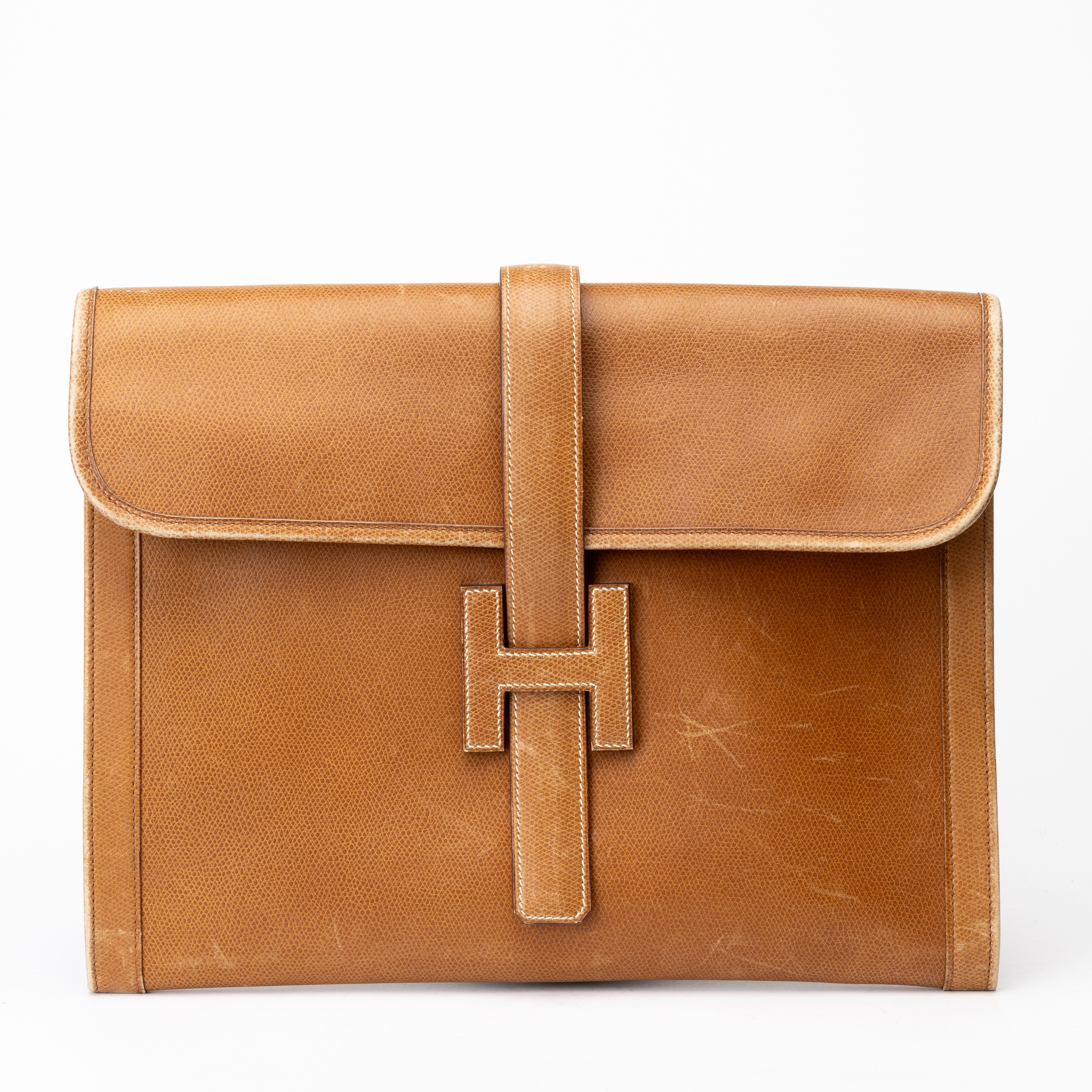 HERMÈS. Clutch, "Gold Jige Clutch".