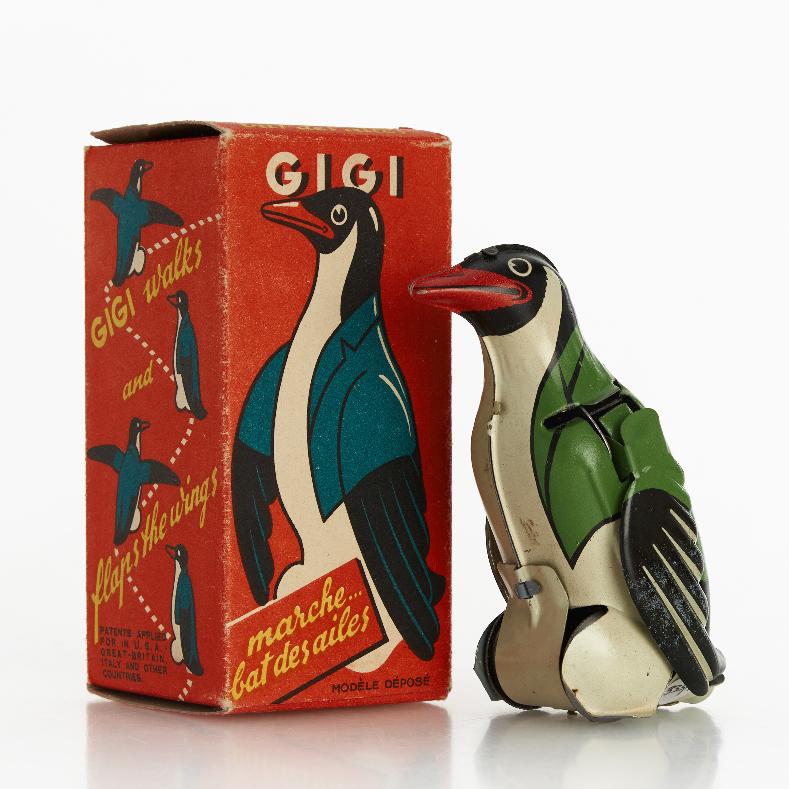 JOUSTRA, "Gigi", litograferad plåt, urverk, originalkartong, Frankrike, 1940-tal.