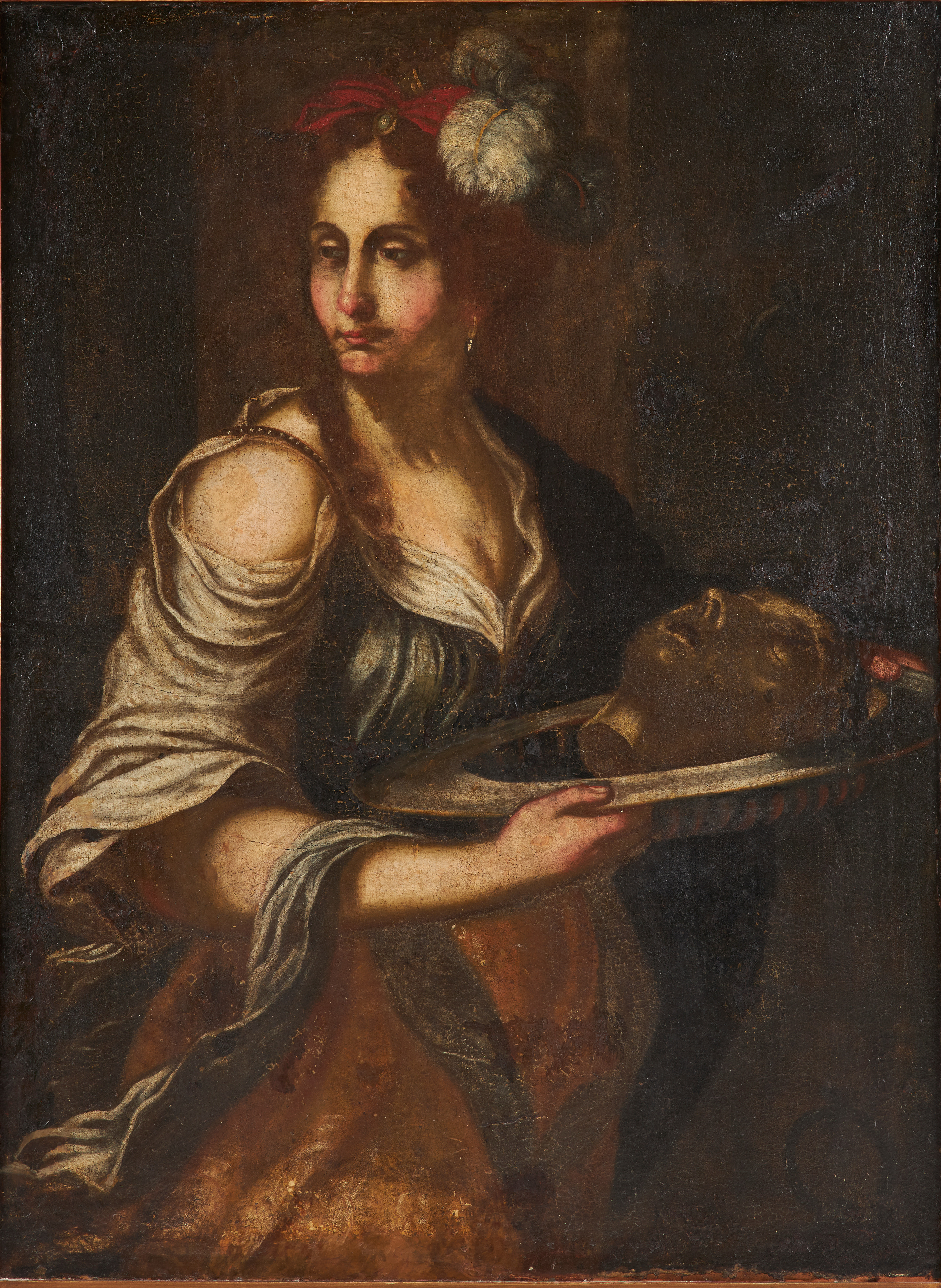OKÄND KONSTNÄR. Salome med Johannes döparens huvud, 1600/1700-tal, eller möjligen Judith med Holofernes huvud, olja på duk senare förstärkt med pannå.