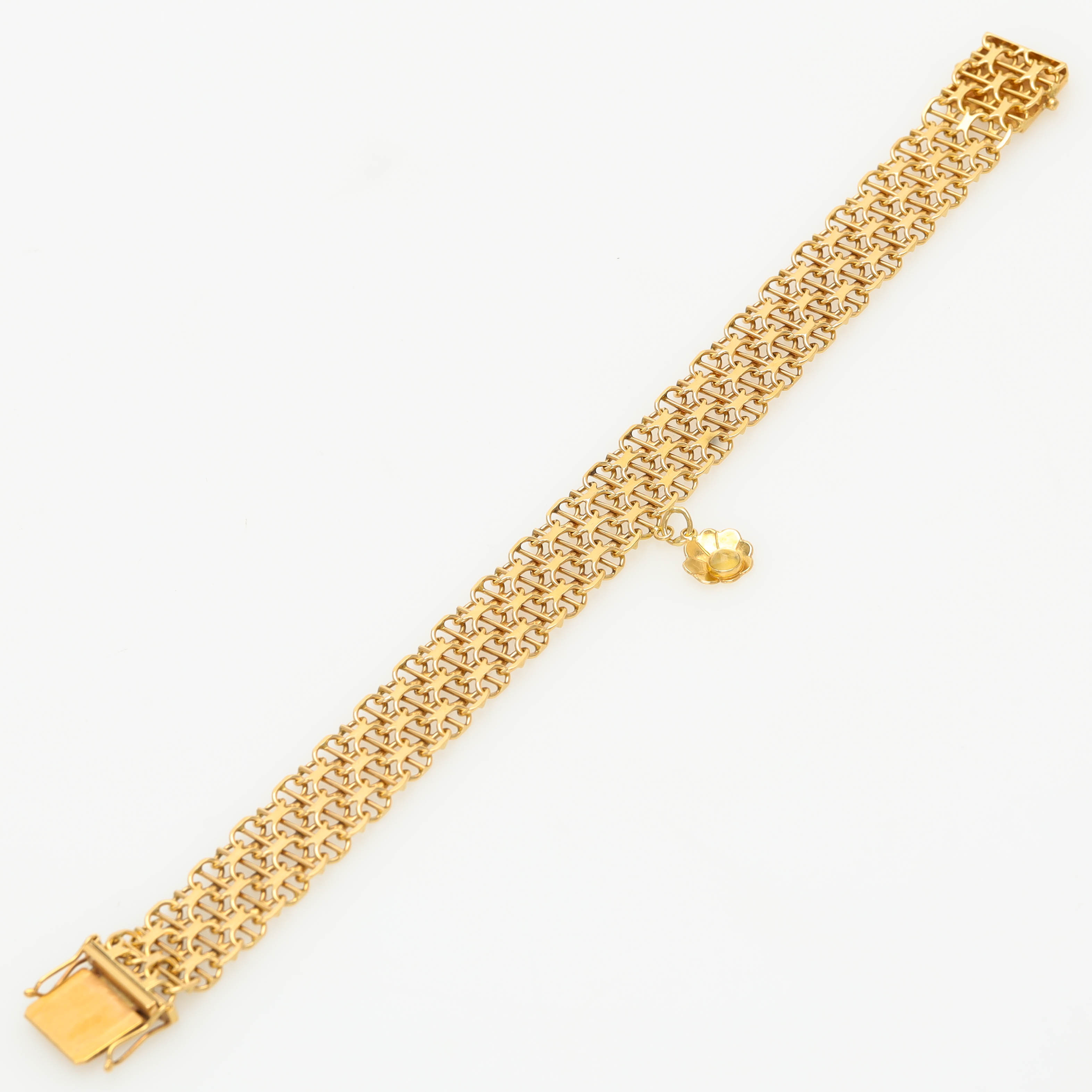 ARMBAND, 18 k guld, x-länk med stav, berlock, integrerat kistlås.