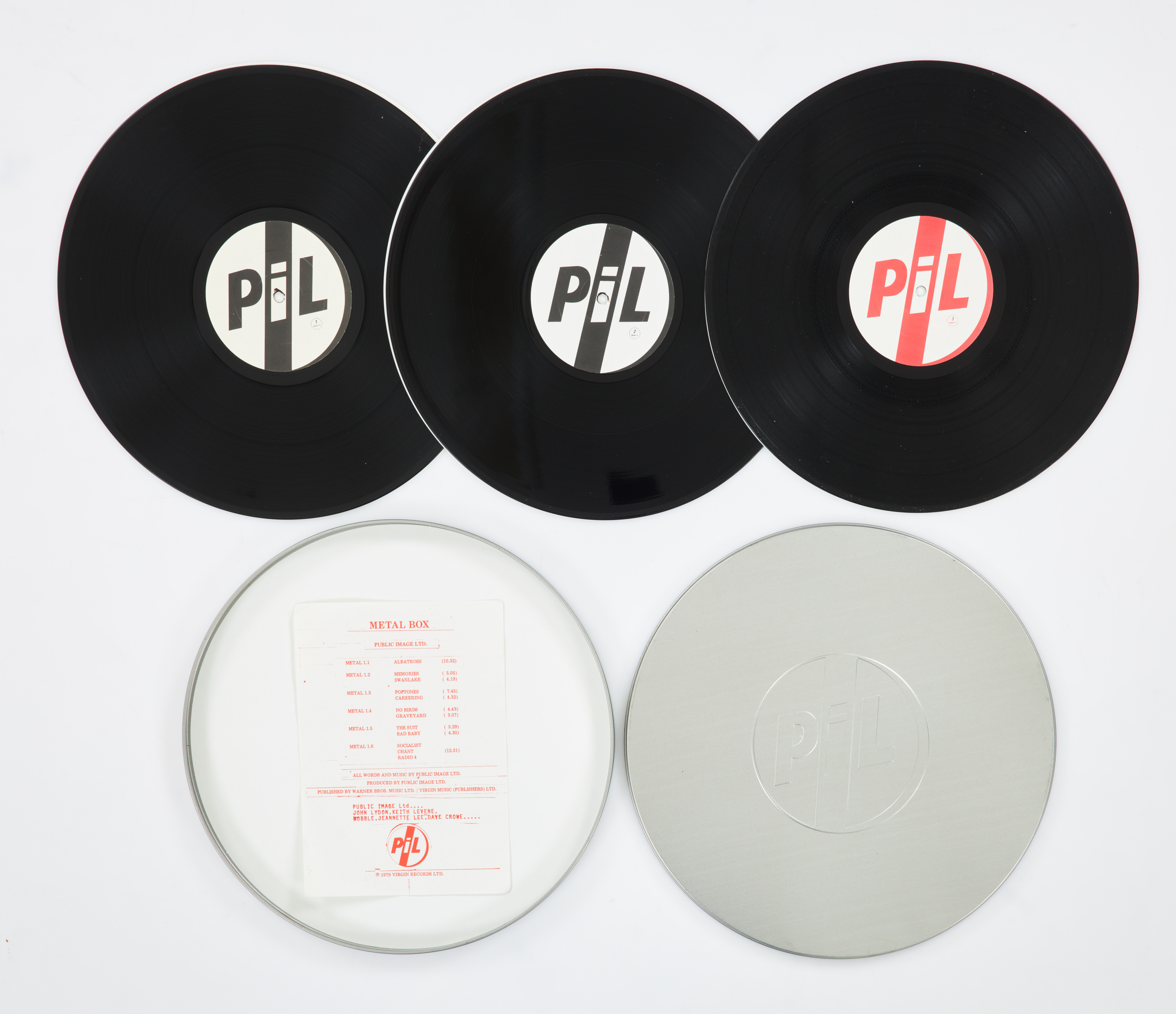 VINYLSKIVA, Public Image Ltd, / PiL* – Metal Box, 3x 45 rpm, runt omslag i plåt, Virgin Metal 1.