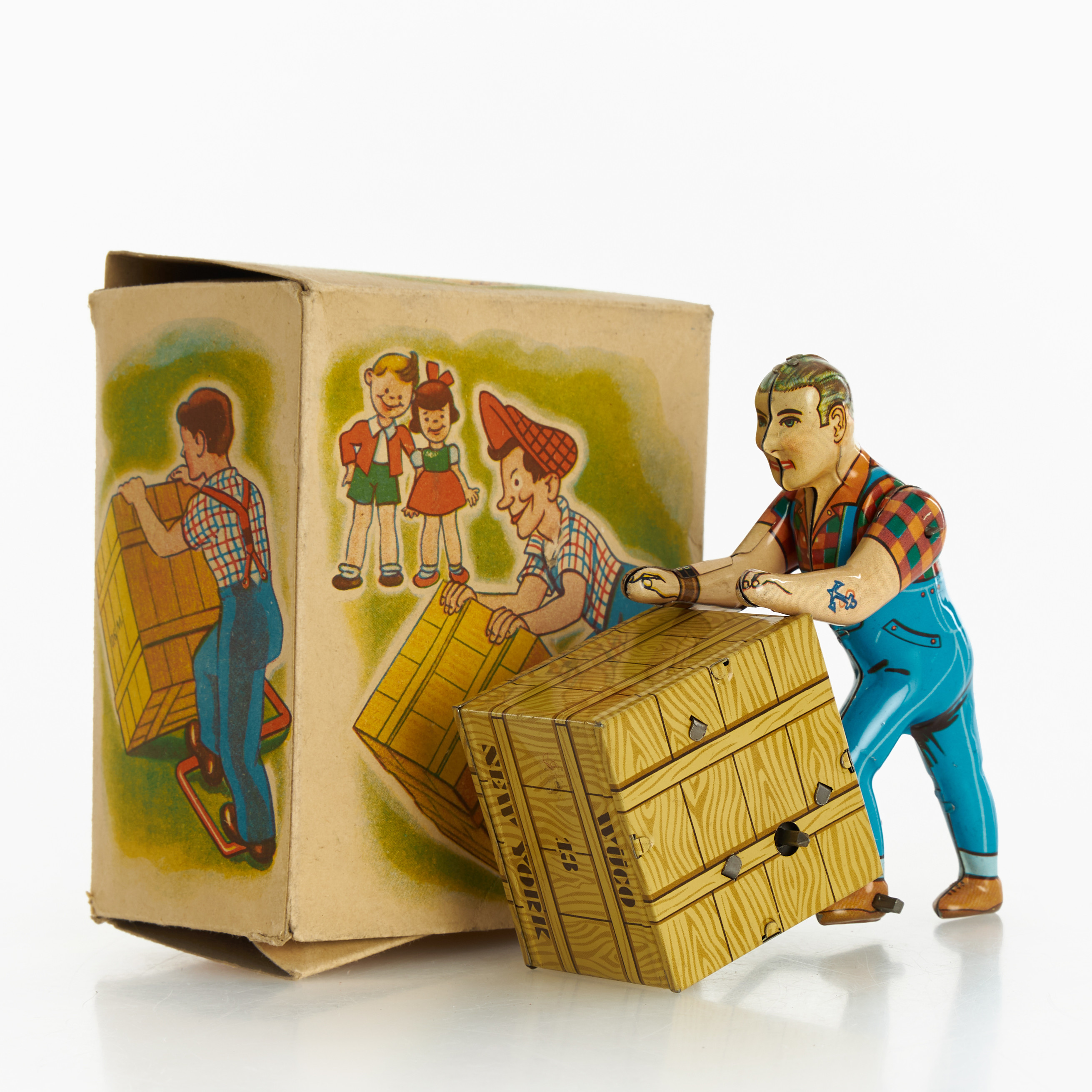 PLÅTLEKSAK, man med låda, litograferad plåt, urverk, originalkartong, U.S Zone, Tyskland, 1940/50-tal.