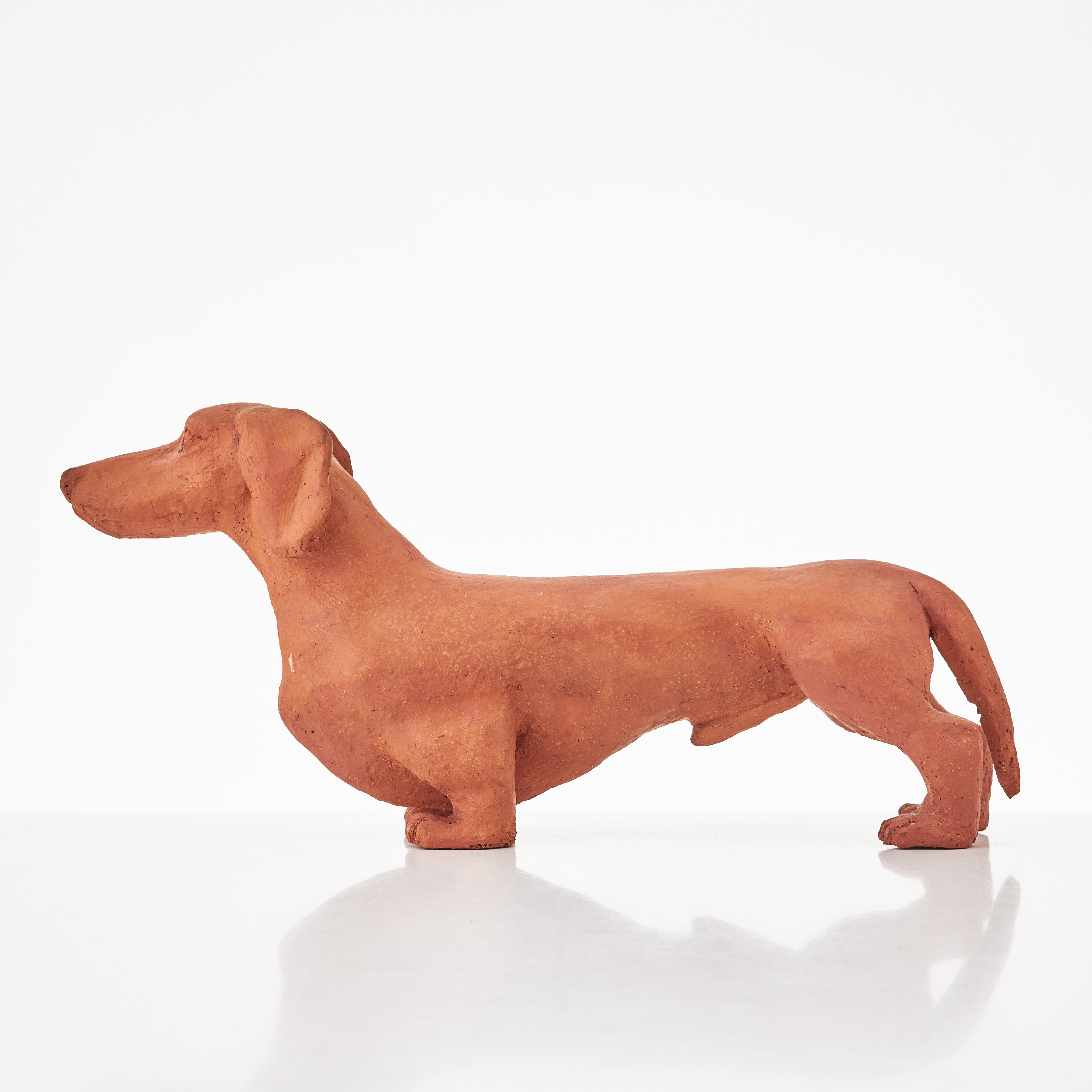 SKULPTUR, i form av tax, lergods, monogram signerad och daterad PT 65?