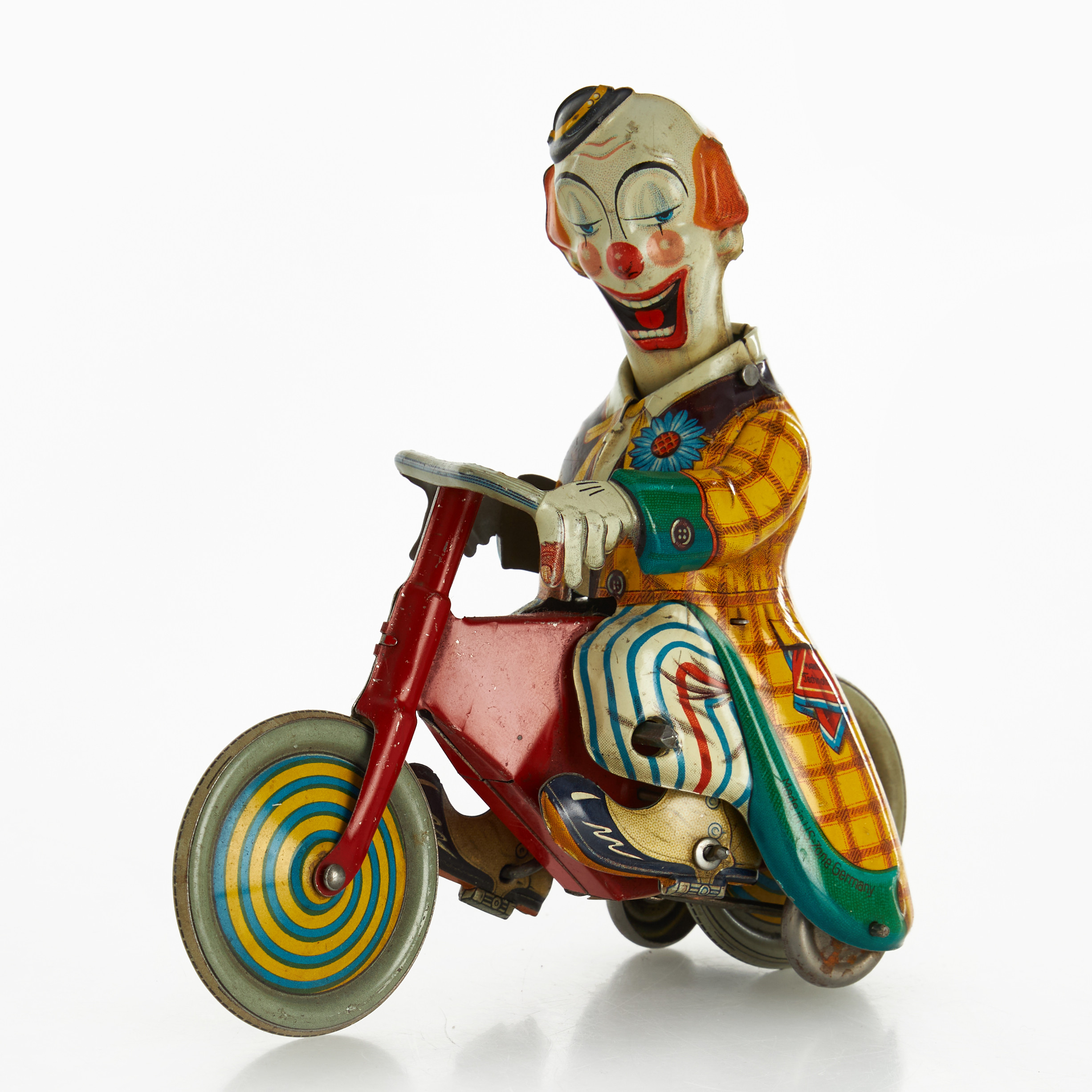 TECHNOFIX, cyklande clown, litograferad plåt, urverk, U.S Zone, Tyskland, 1950-tal.