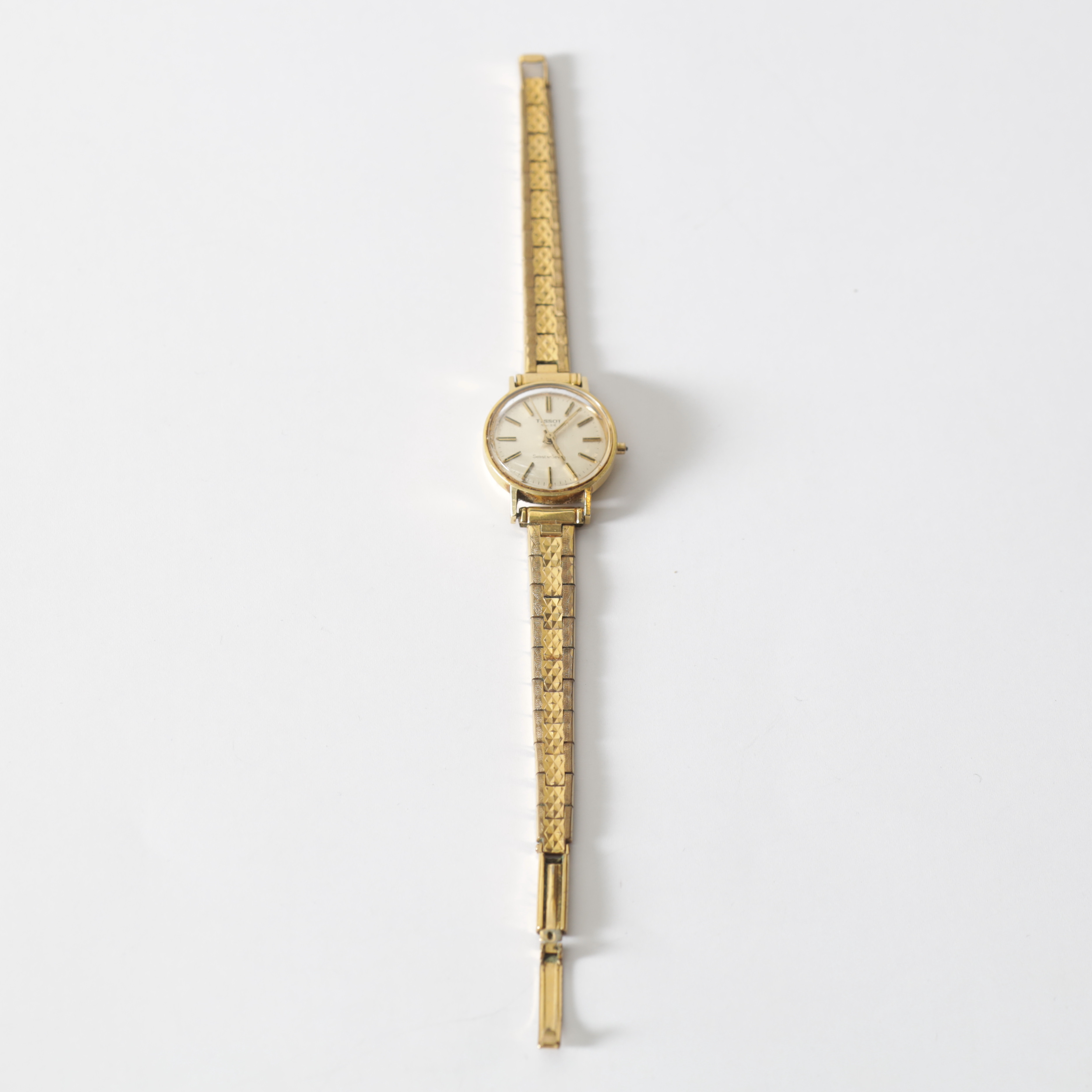 ARMBANDSUR, 18K guld i boett, Tissot, 1900-tal. Totalvikt med armband ca 27,5 g.