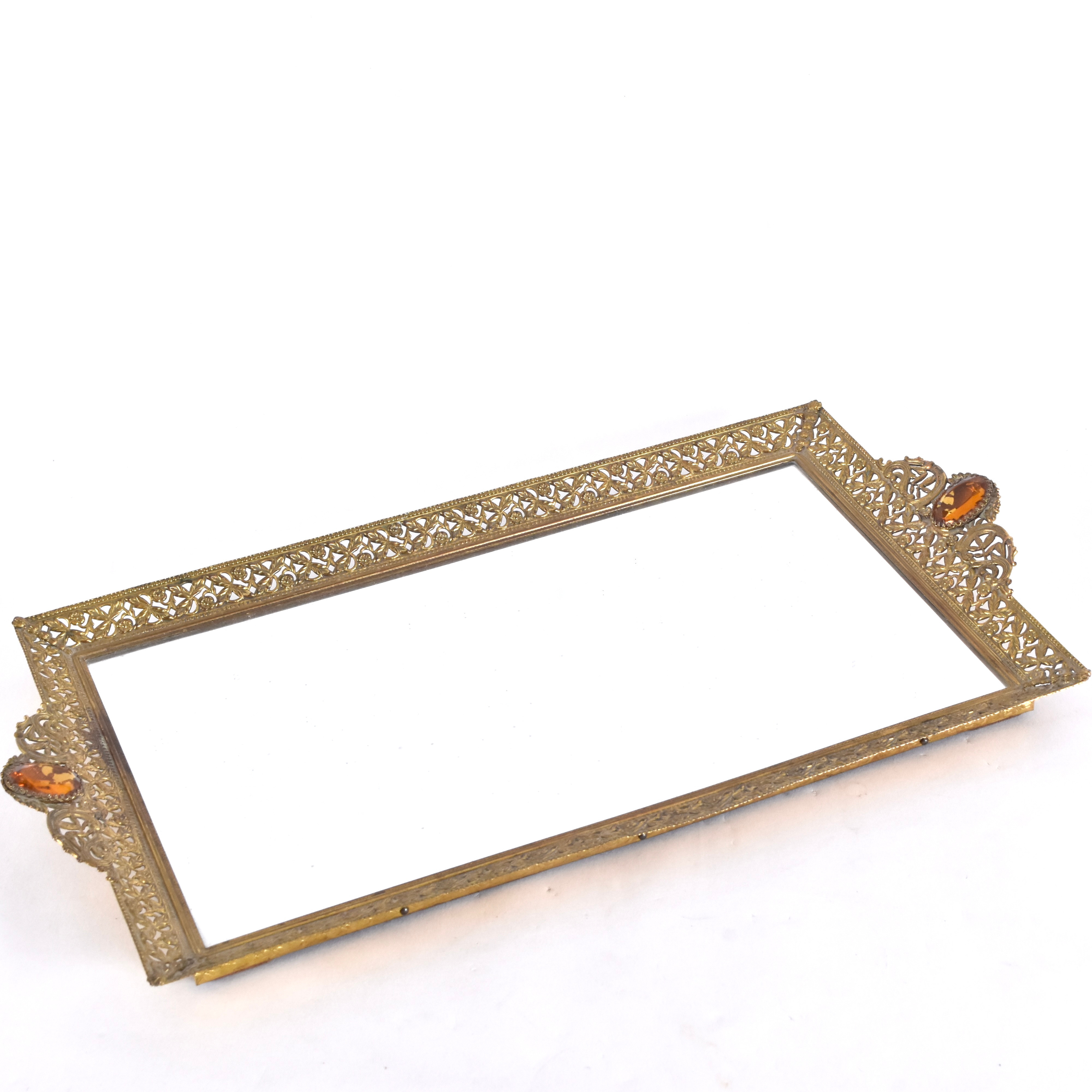 SPEGELBRICKA; mässing med glasfluss.