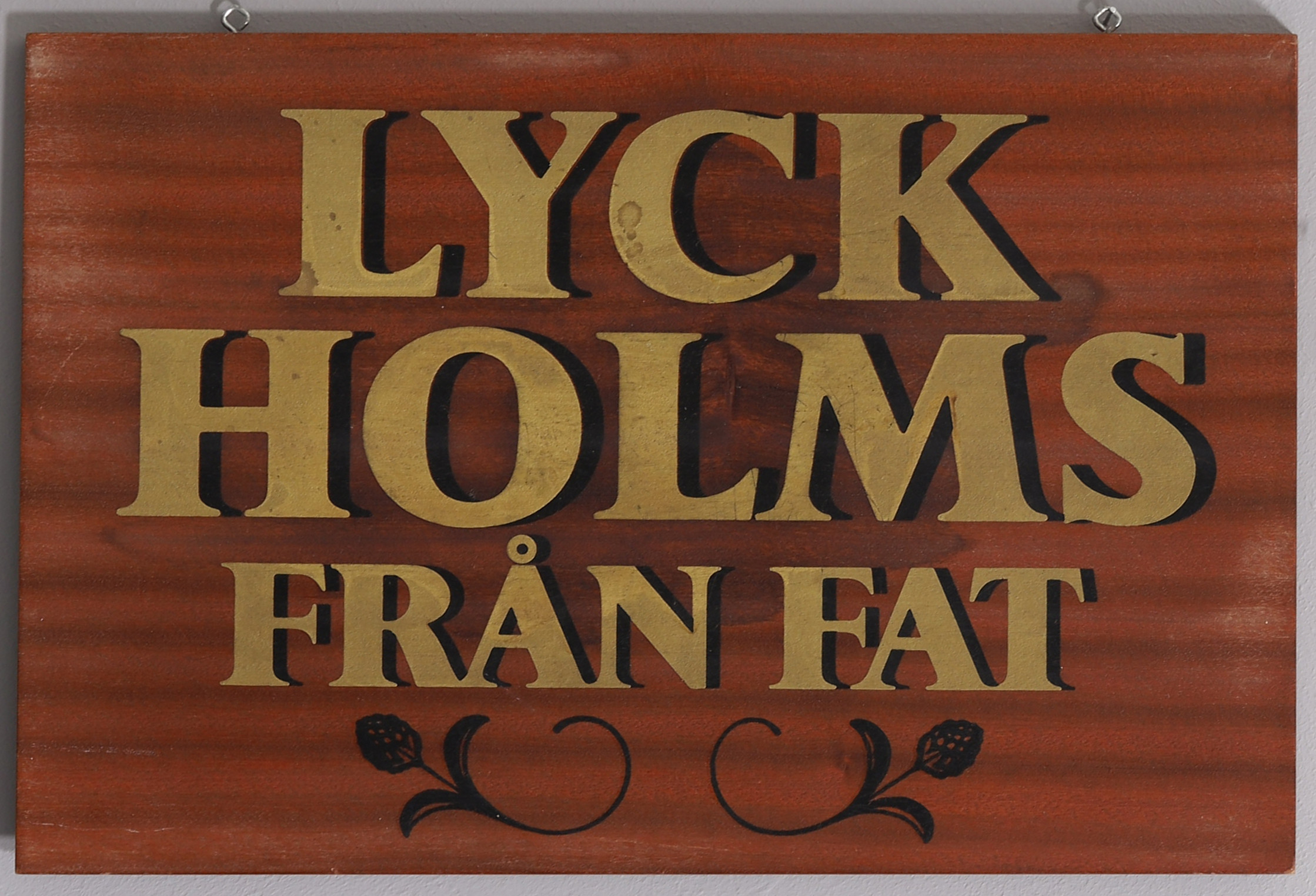 LYCKHOLMS FRÅN FAT, bemålad teakplatta , reklam. 1900-talets andra hälft.