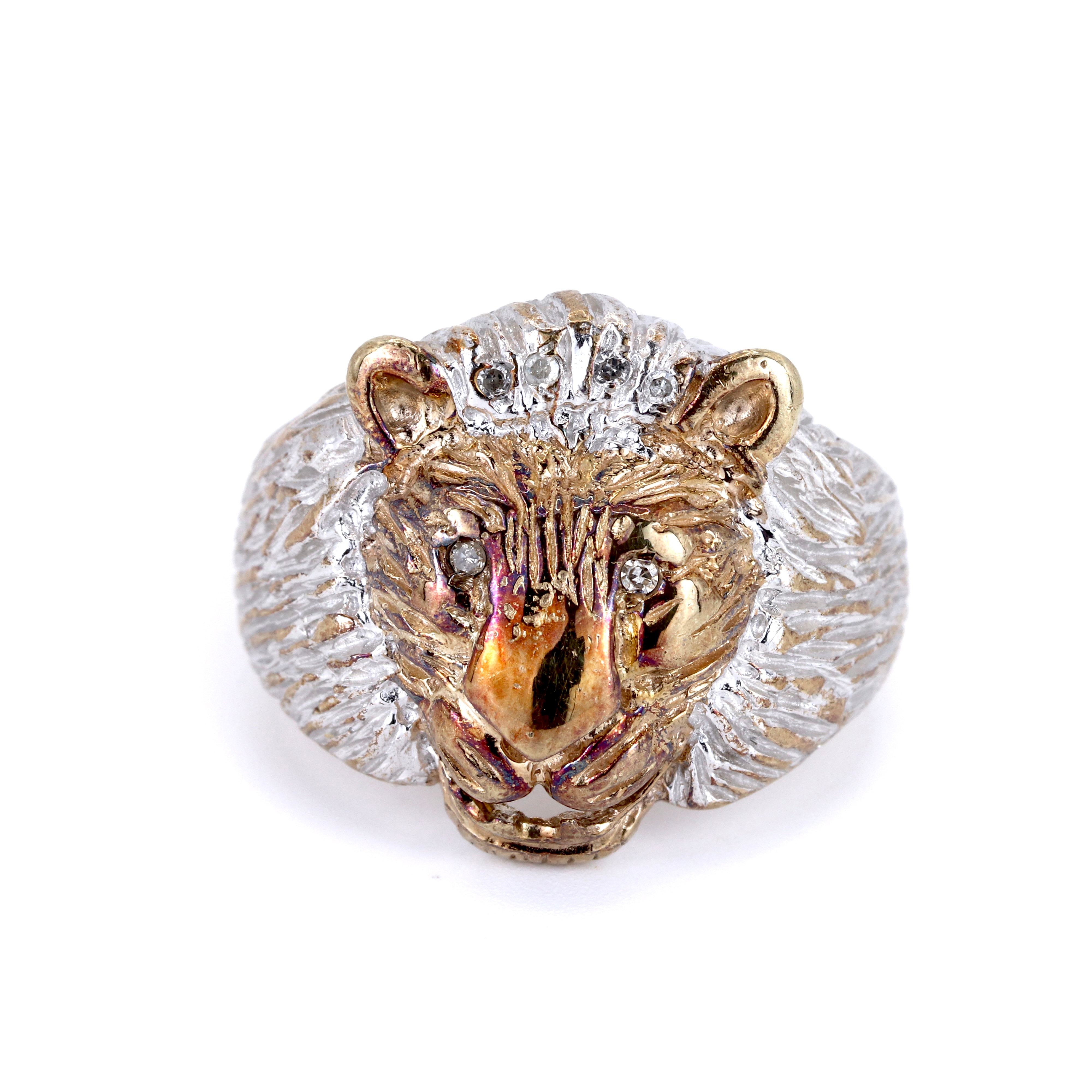 9CT GOLD DIAMOND SET LION FACE RING.