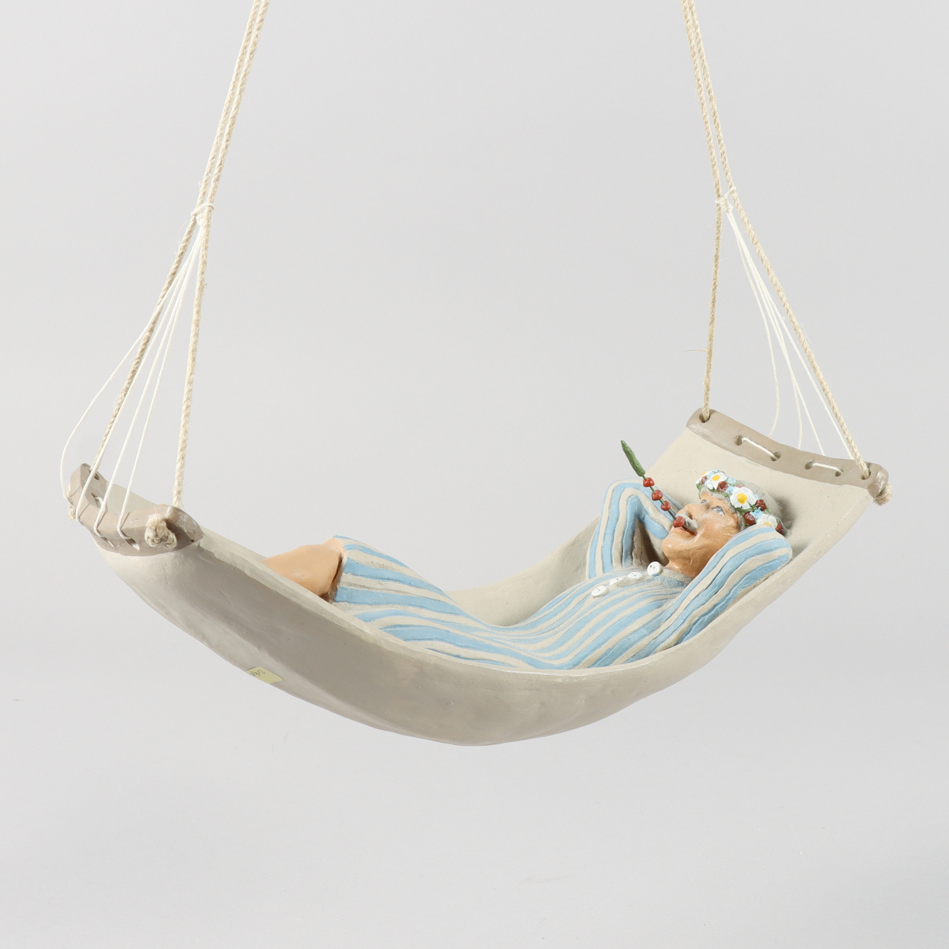 ERKERS MARIE PERSSON. Figurin, Stengods, "Karl-Anton i hängmattan", samtida.