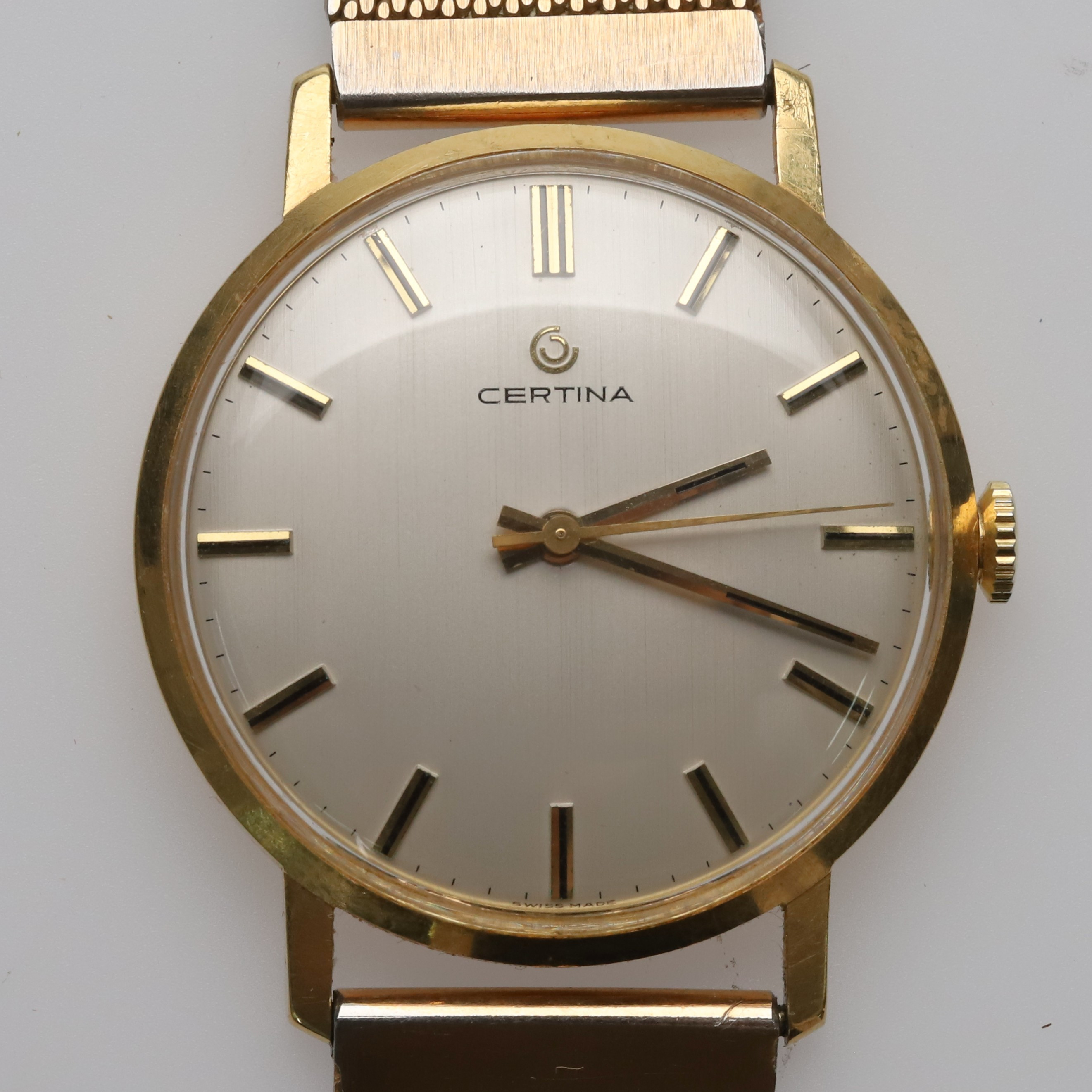 Armbandsur, Certina, manuell, 18K guld, Ø 34 mm.