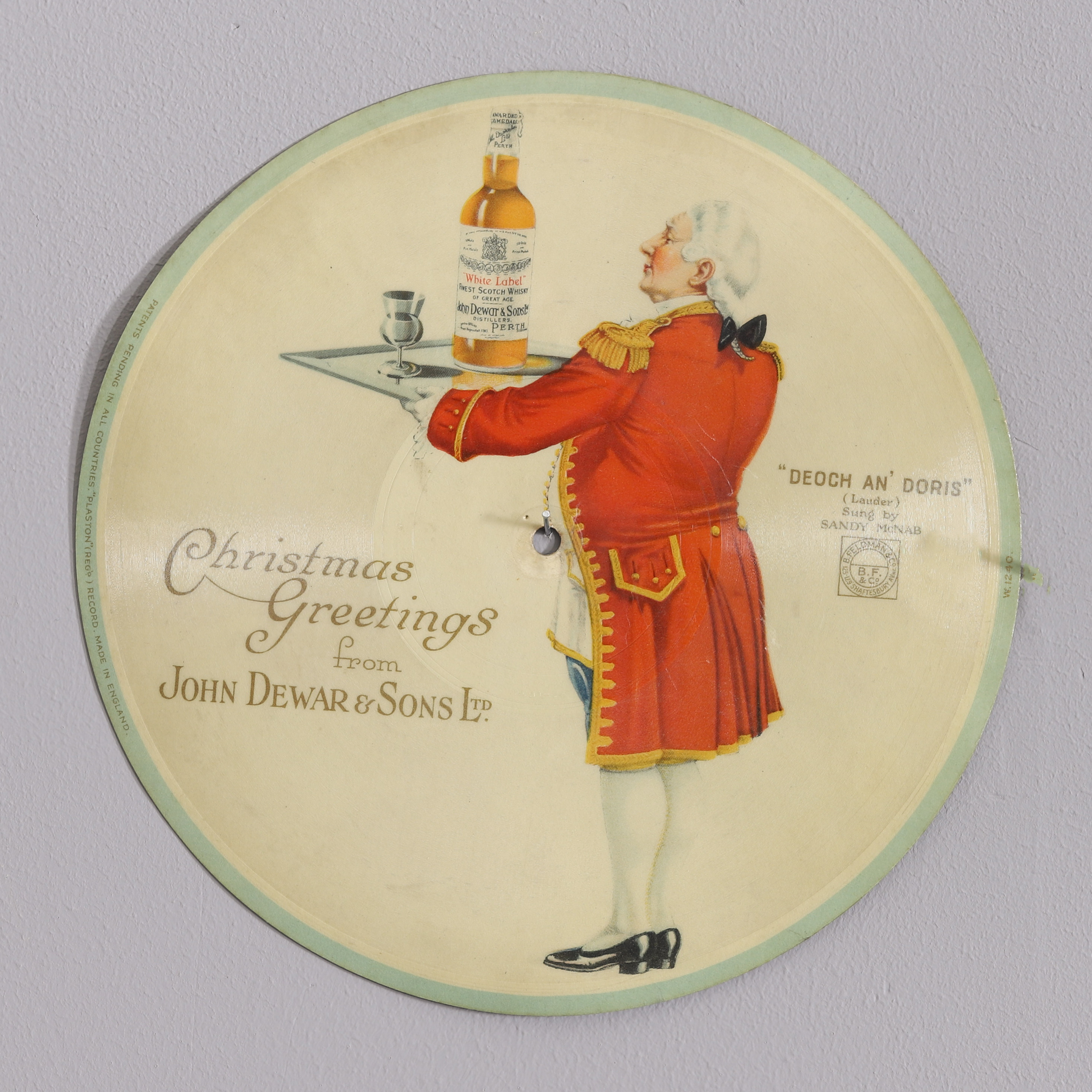 JOHN DEWAR & SONS LTD, "Christmas Greetings" flexiskiva . Reklam. 1930-40-tal.
