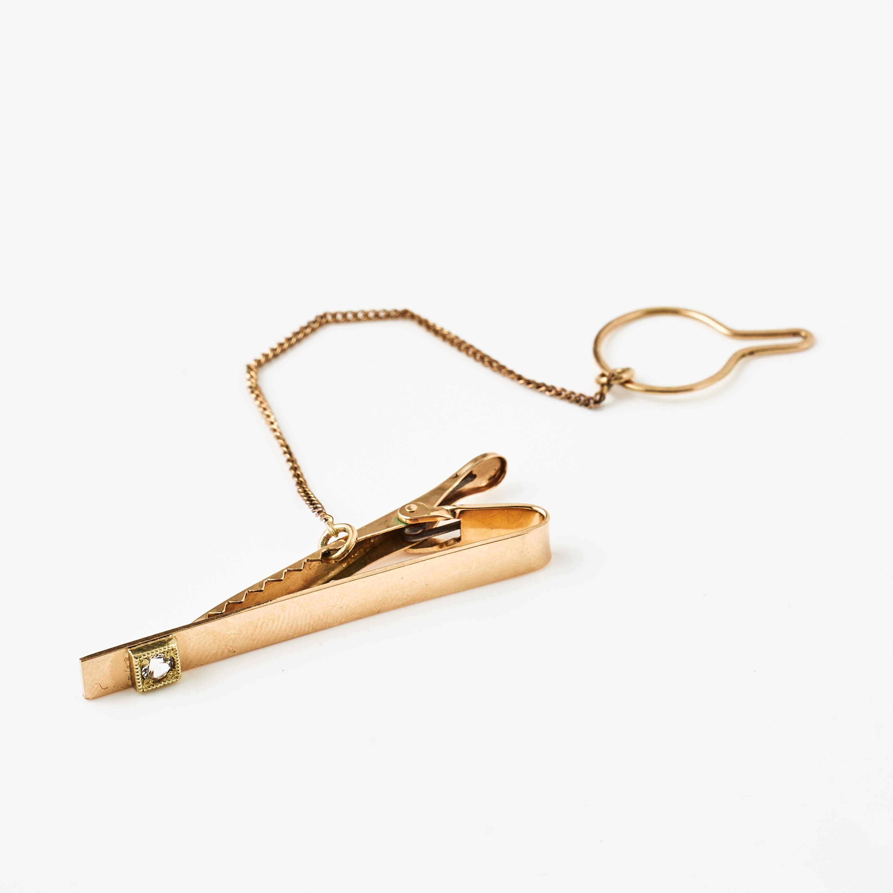 SLIPSHÅLLARE, 18 k guld, dekor med fasettslipad vit sten, svensk kontrollstämpel.