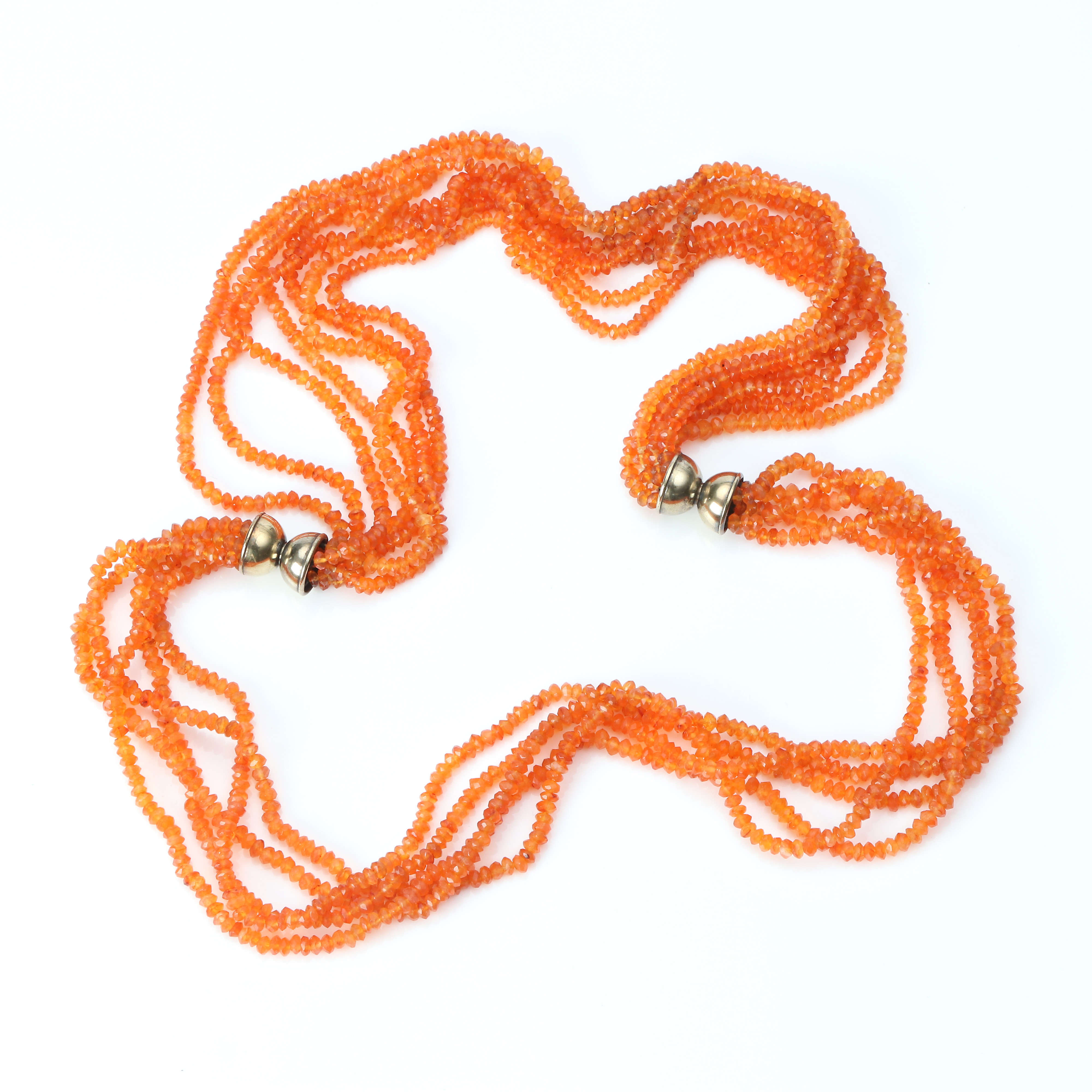 COLLIERER, TVÅ ST. Orange fasetterade stenar, troligen eldopal, lås i förgyllt silver.