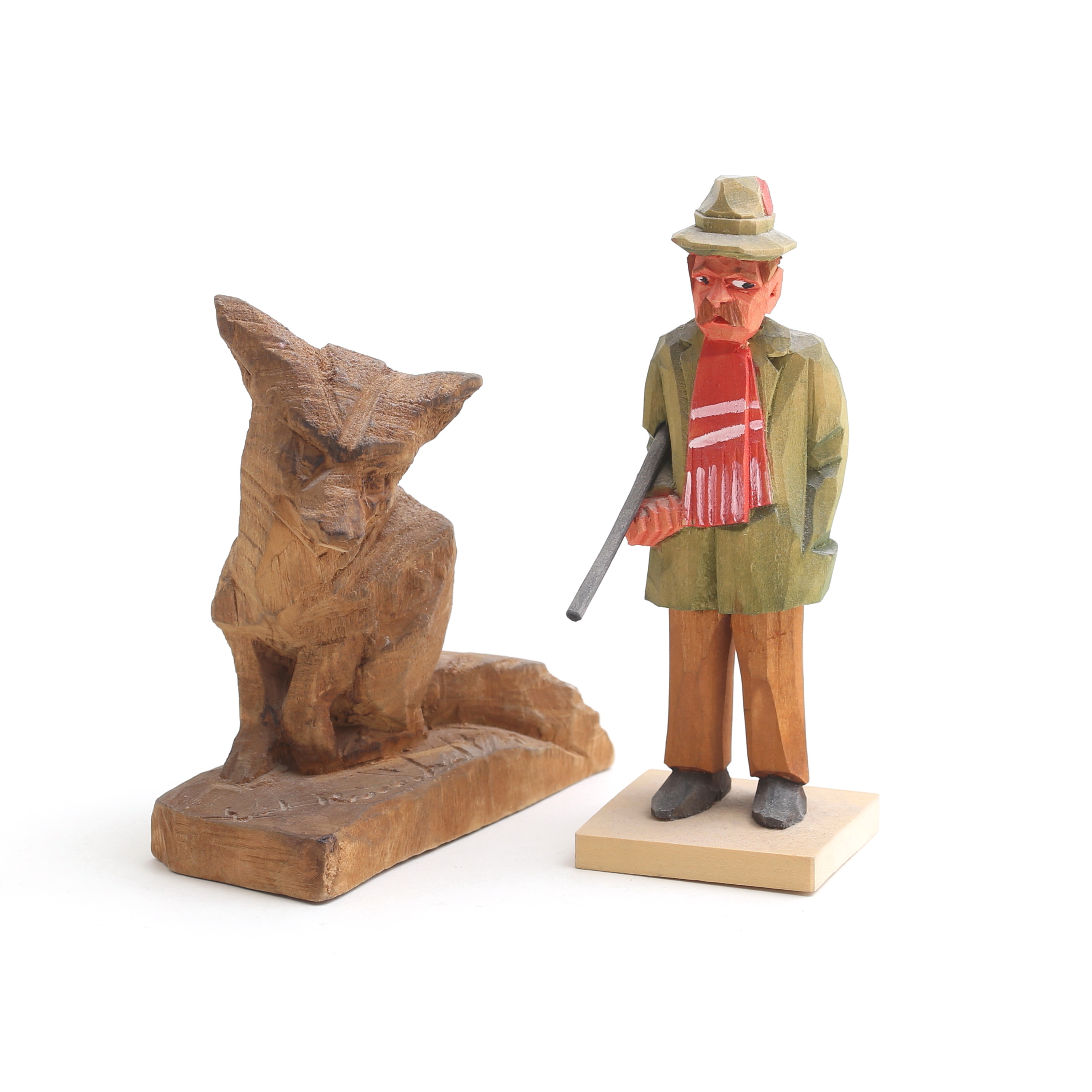 ERIK REIMHULT / ERIK ERIKSSON. Träskulpturer, 2 st, rävunge samt jägare.