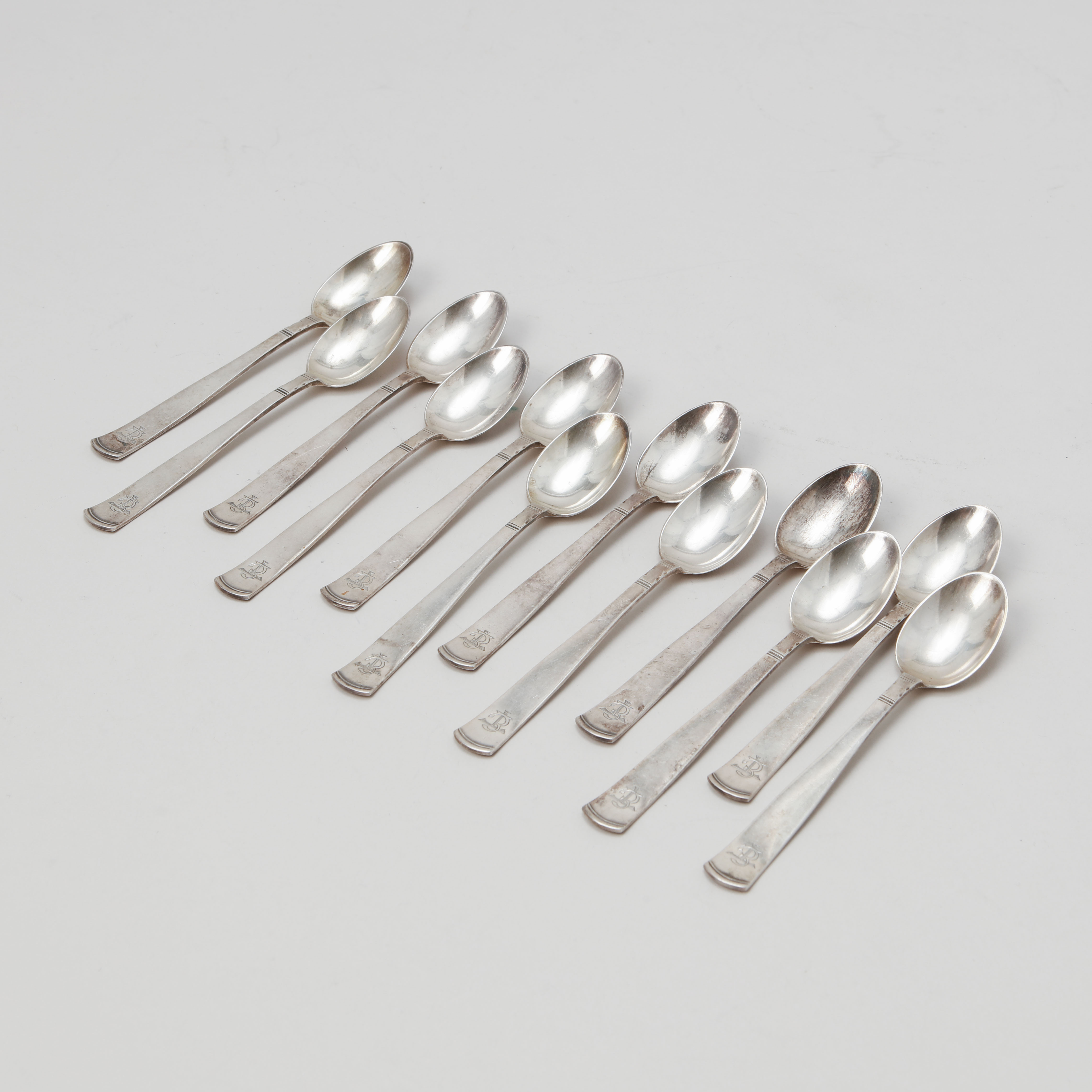 JACOB ÄNGMAN. Skedar, 12 stycken, silver, "Rosenholm", GAB. Vikt 185 gram.