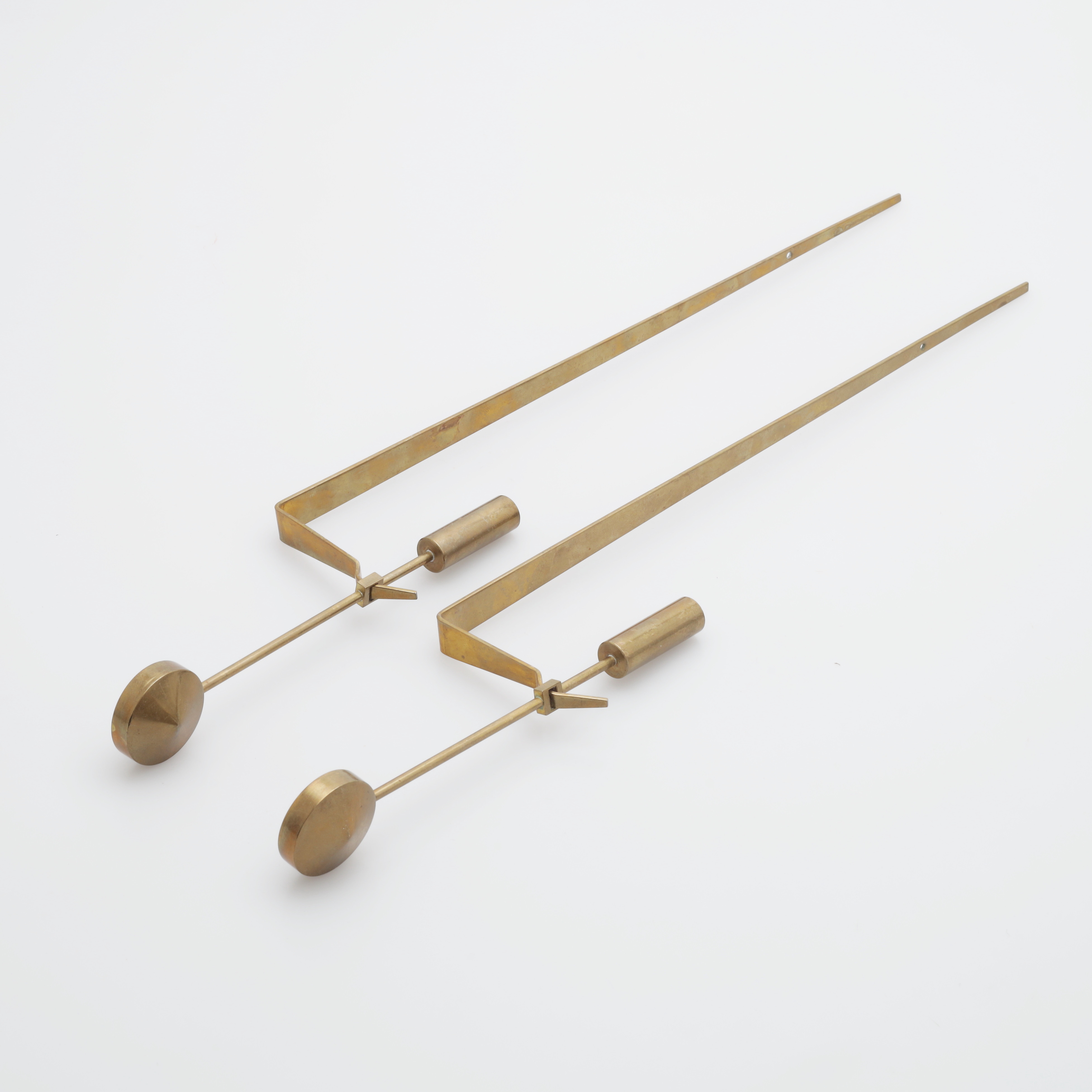 PIERRE FORSELL. "Pendel", ljuslampetter, 1 par, mässing, nr 1607, Skultuna, signerade.