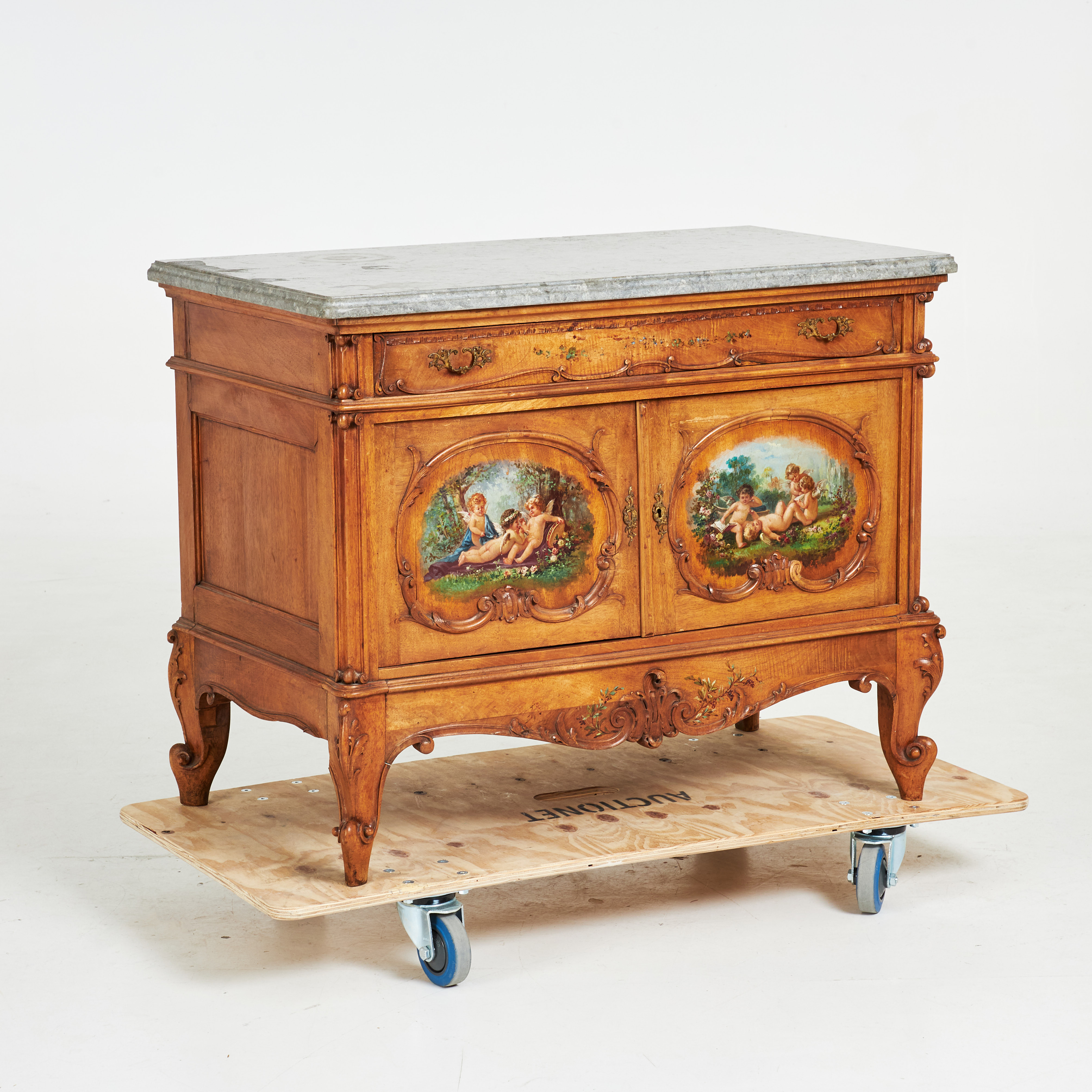 BYRÅ, 1900-talets första hälft, valnöt, skuren dekor, skiva i kalksten, bemålad med bl.a. figurscener, bemålningen signerad samt daterad 1909.