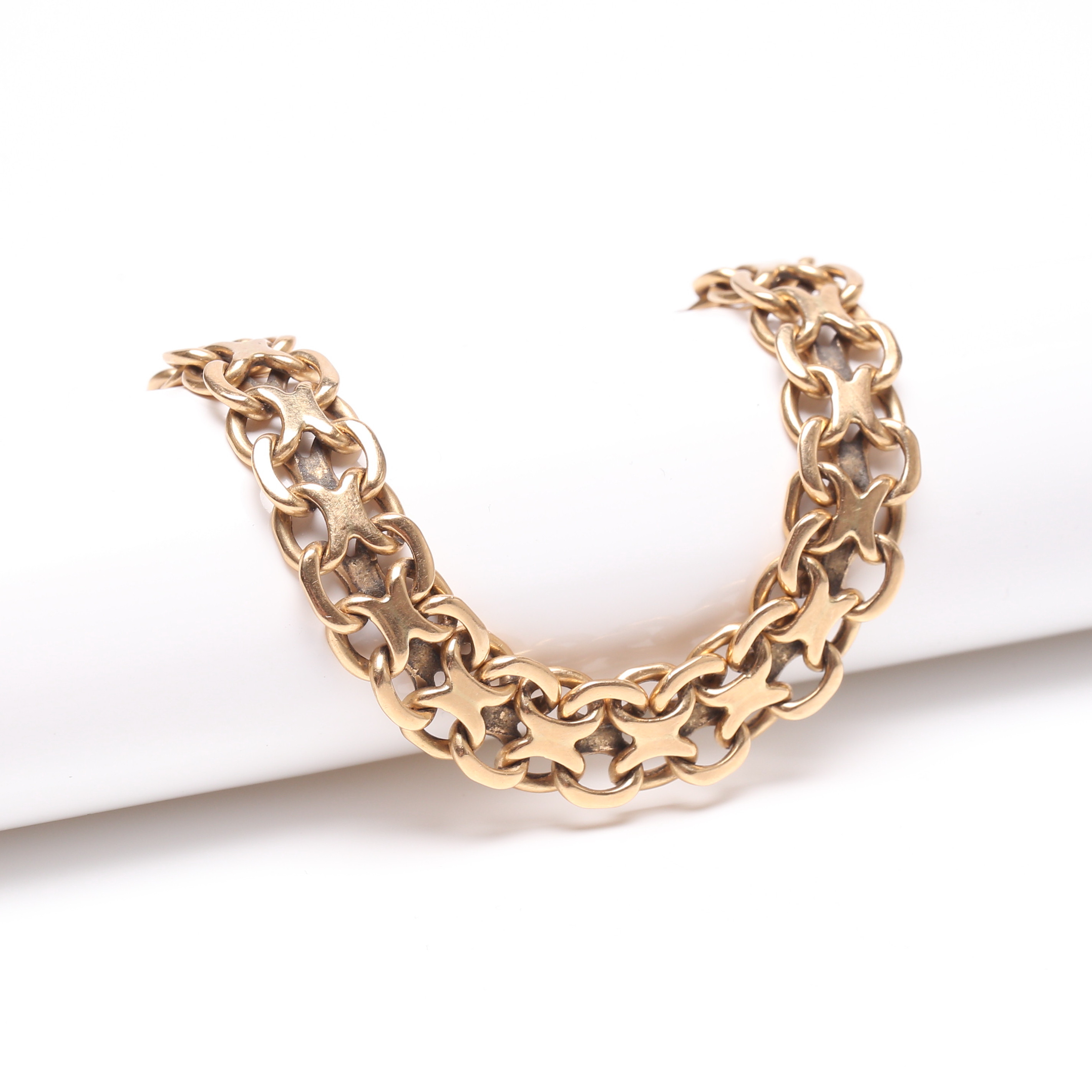 ARMBAND, ''x-länk'', 18k guld, vikt ca 29,2 g.