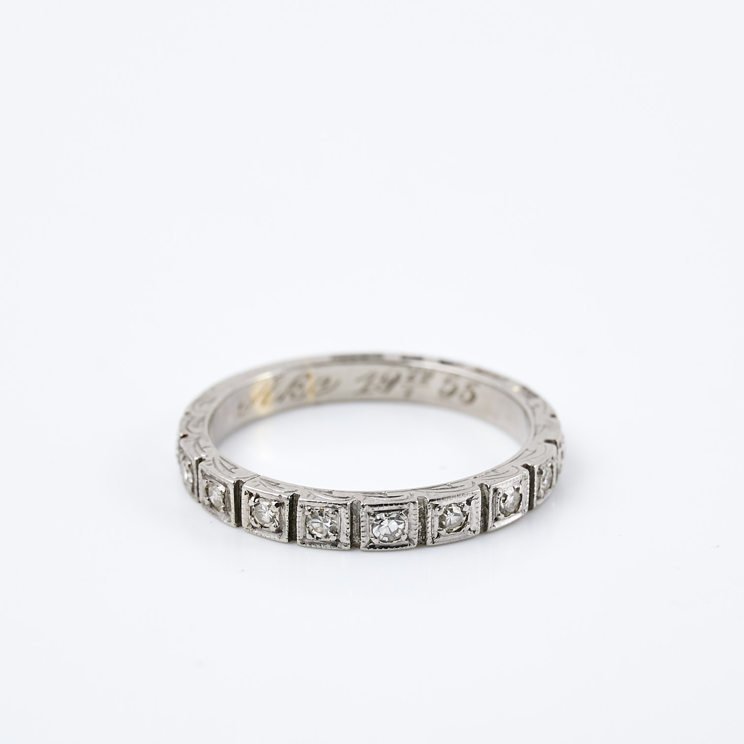 RING. s.k. halvalliansring, 18 k vitguld, 10 åttkantslipade diamanter, totalt ca 0,15 ct, Guldvaruaktiebolaget G. Dahlgren & Co Ab, Malmö, 1952.