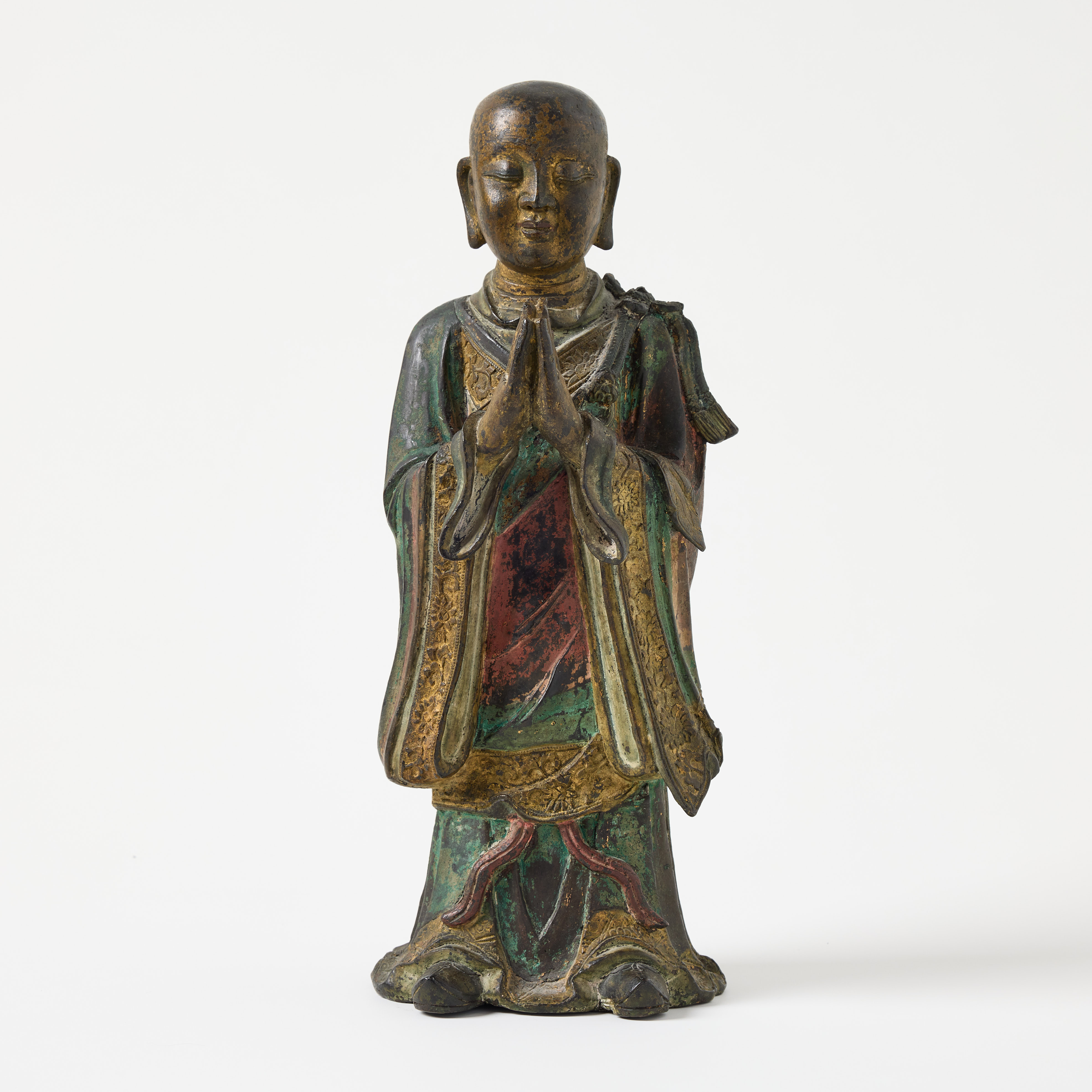 A Chines Ming Bronze Figure of a Lohan.