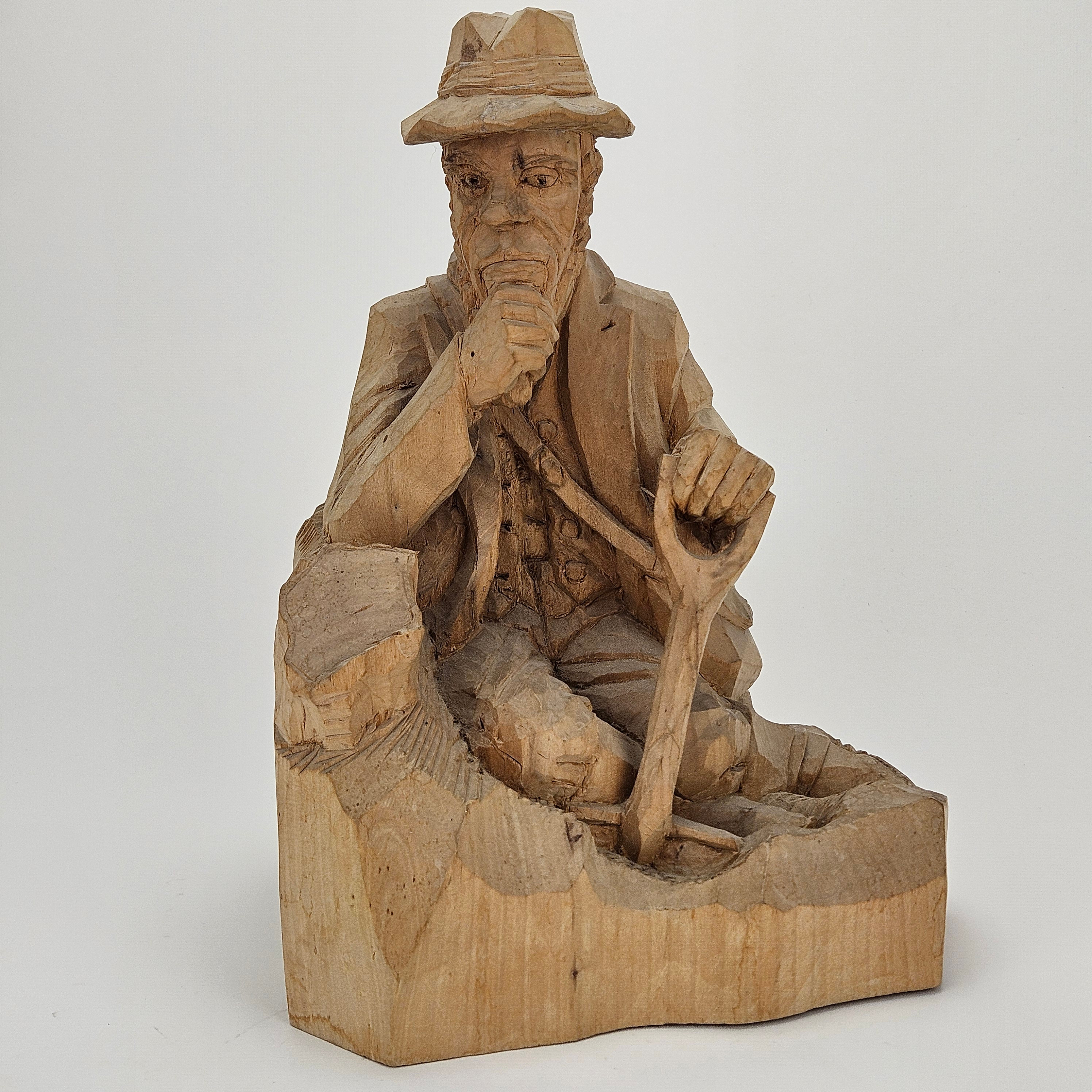 SIGFRID NORDIN. Fundersam man. Skulptur, snidat trä, signerad Nordin och daterad Motala V:std 1931.