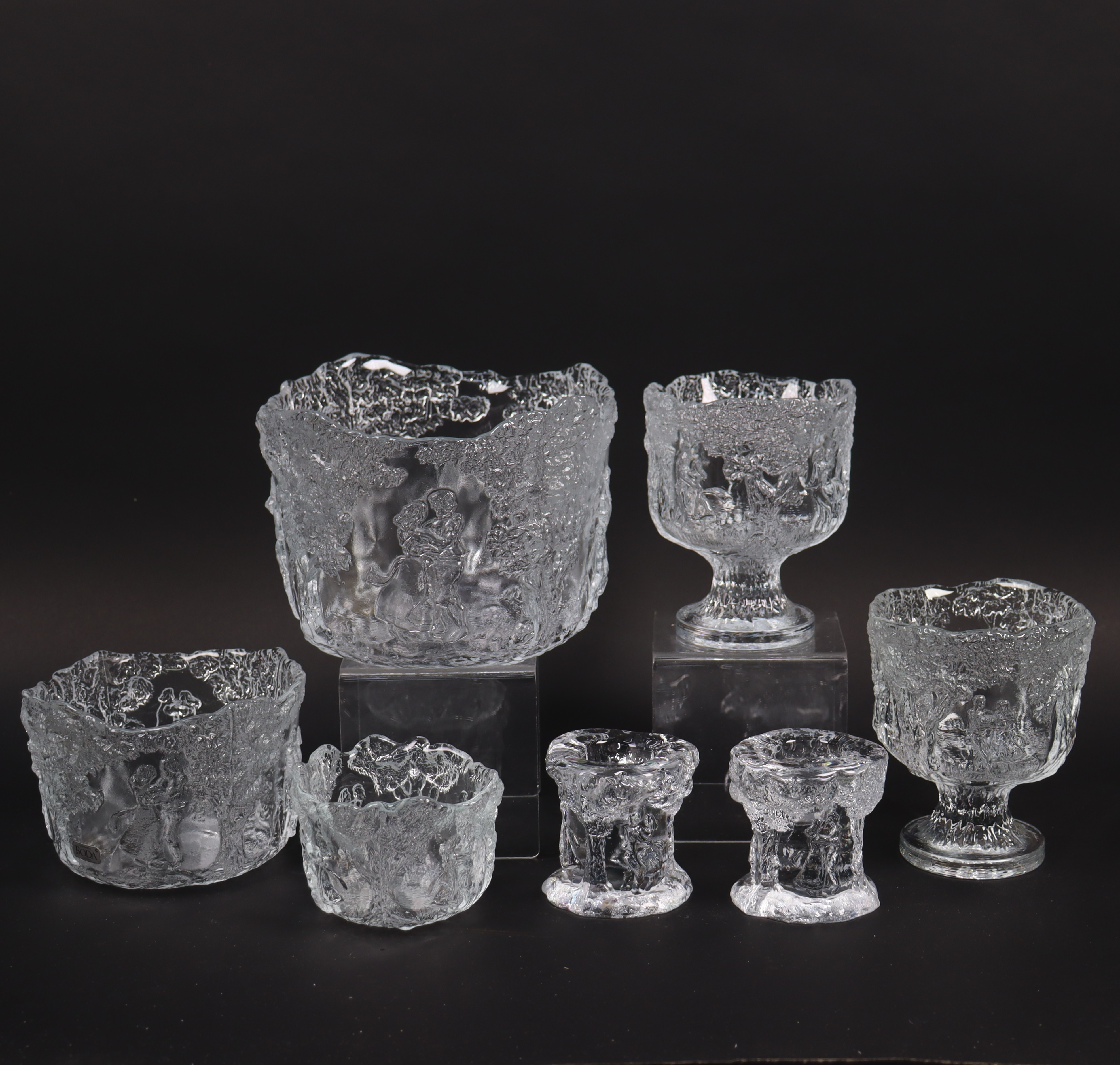 KJELL ENGMAN. "Midsommardansen", Kosta Boda, skålar och ljusstakar, 7 delar.