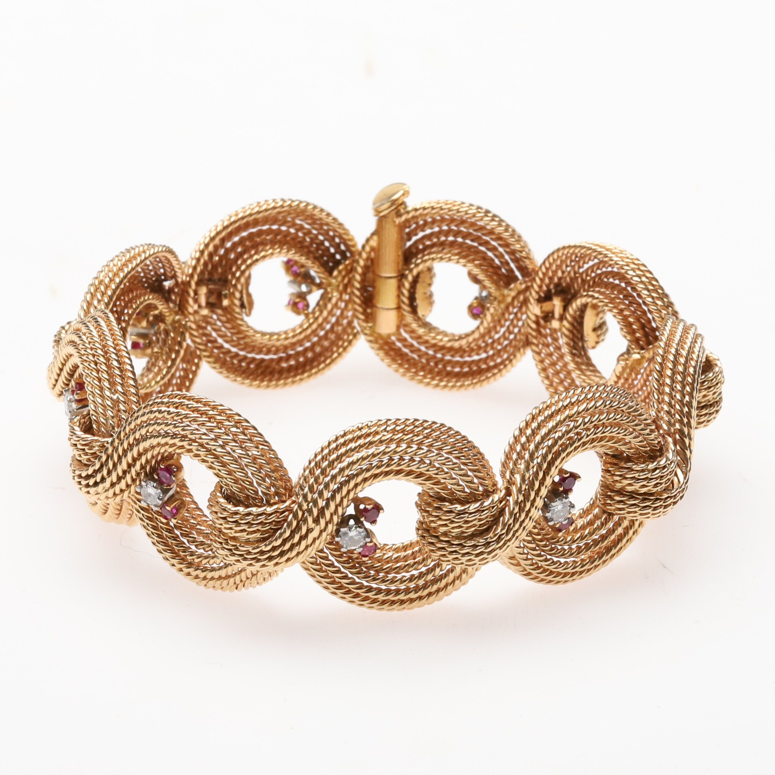 Armband 18K guld med runda briljantslipade diamanter och rubiner.