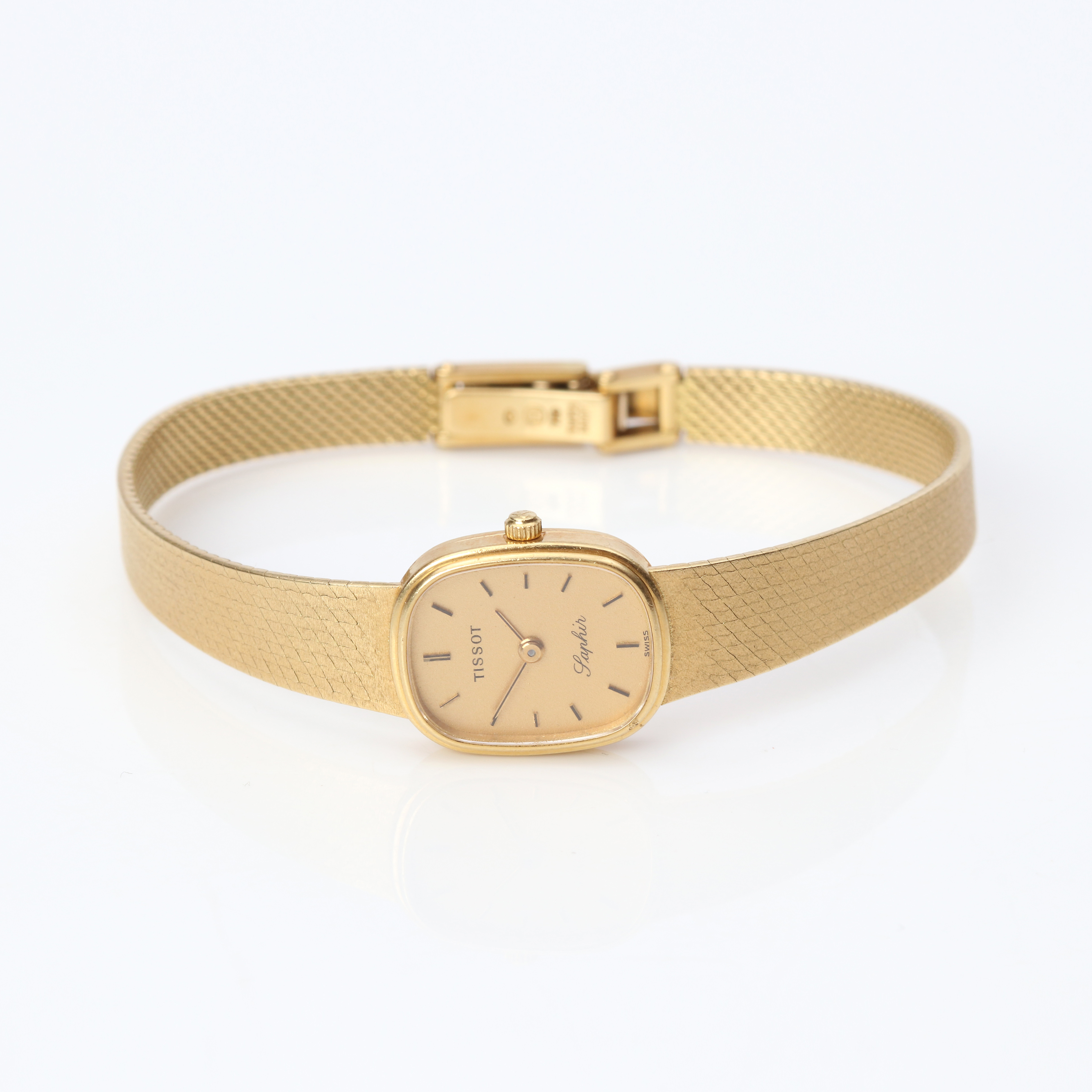 TISSOT SAPHIR, DAMARMBANDSUR. Boett och länk i 18k guld, quartzverk, totalvikt ca 25,5 gram.