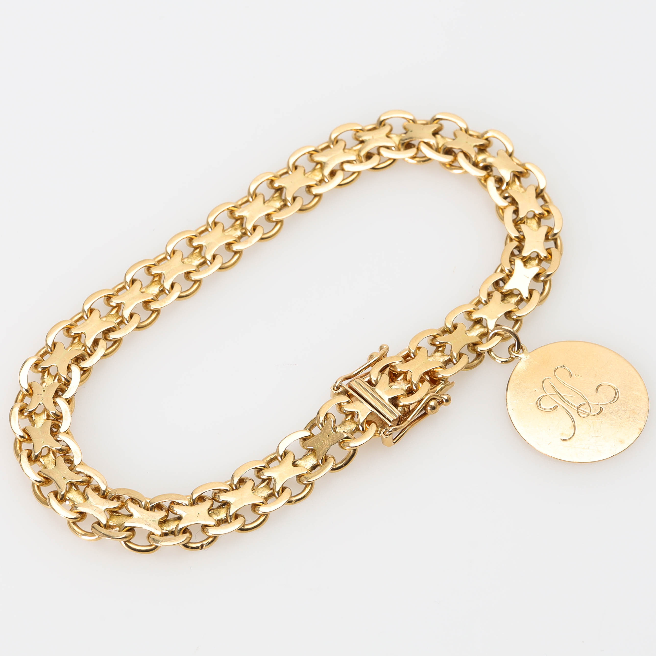ARMBAND, 18 k guld, x-länk, längd 19 cm, berlock, Stockholm 1967.