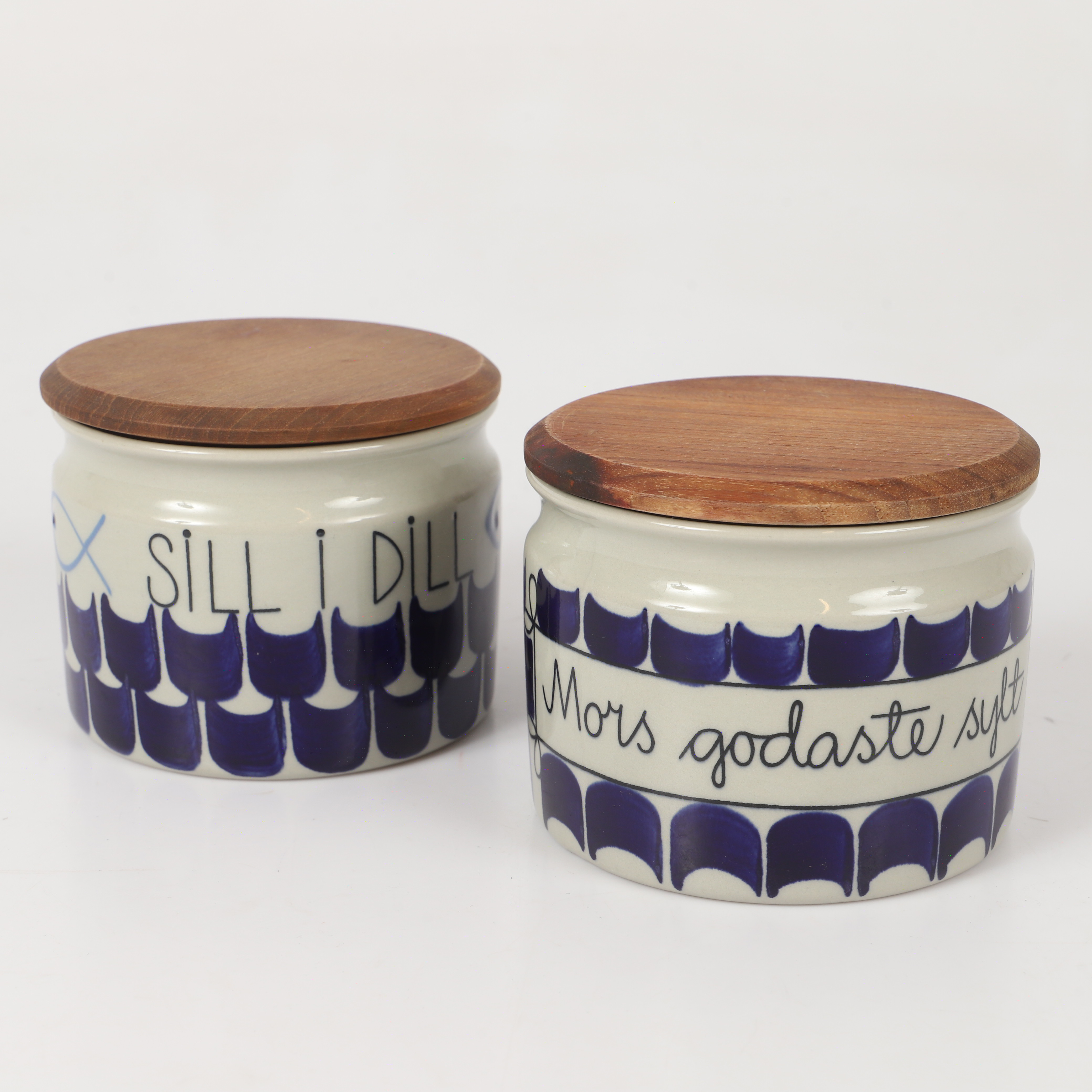 MARIANNE WESTMAN. Burkar, 2 stycken, "Sill i dill" och "Mors godaste sylt", Rörstrand.