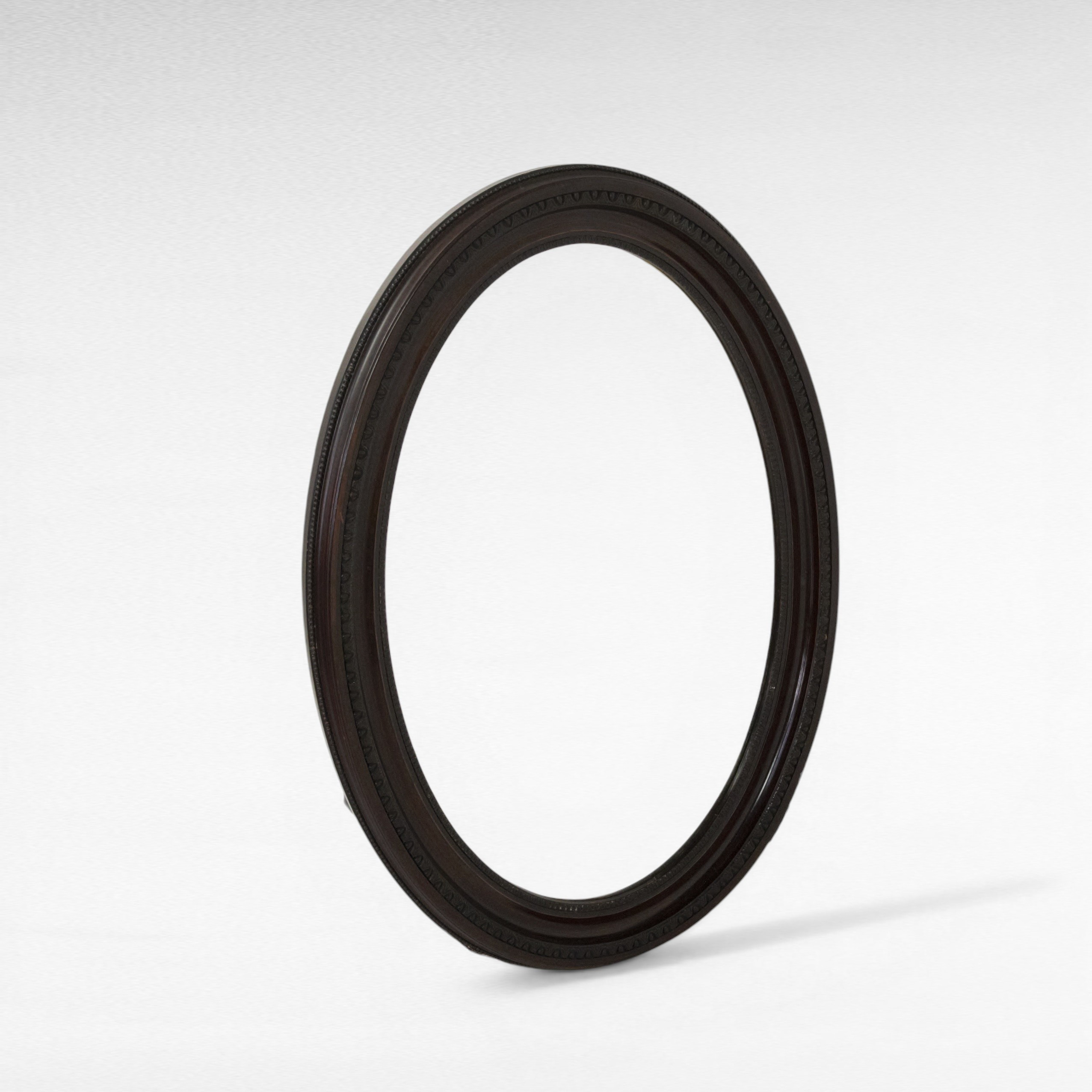 SPEGEL, ram av betsat lövträ, skuren dekor, 1900-tal.