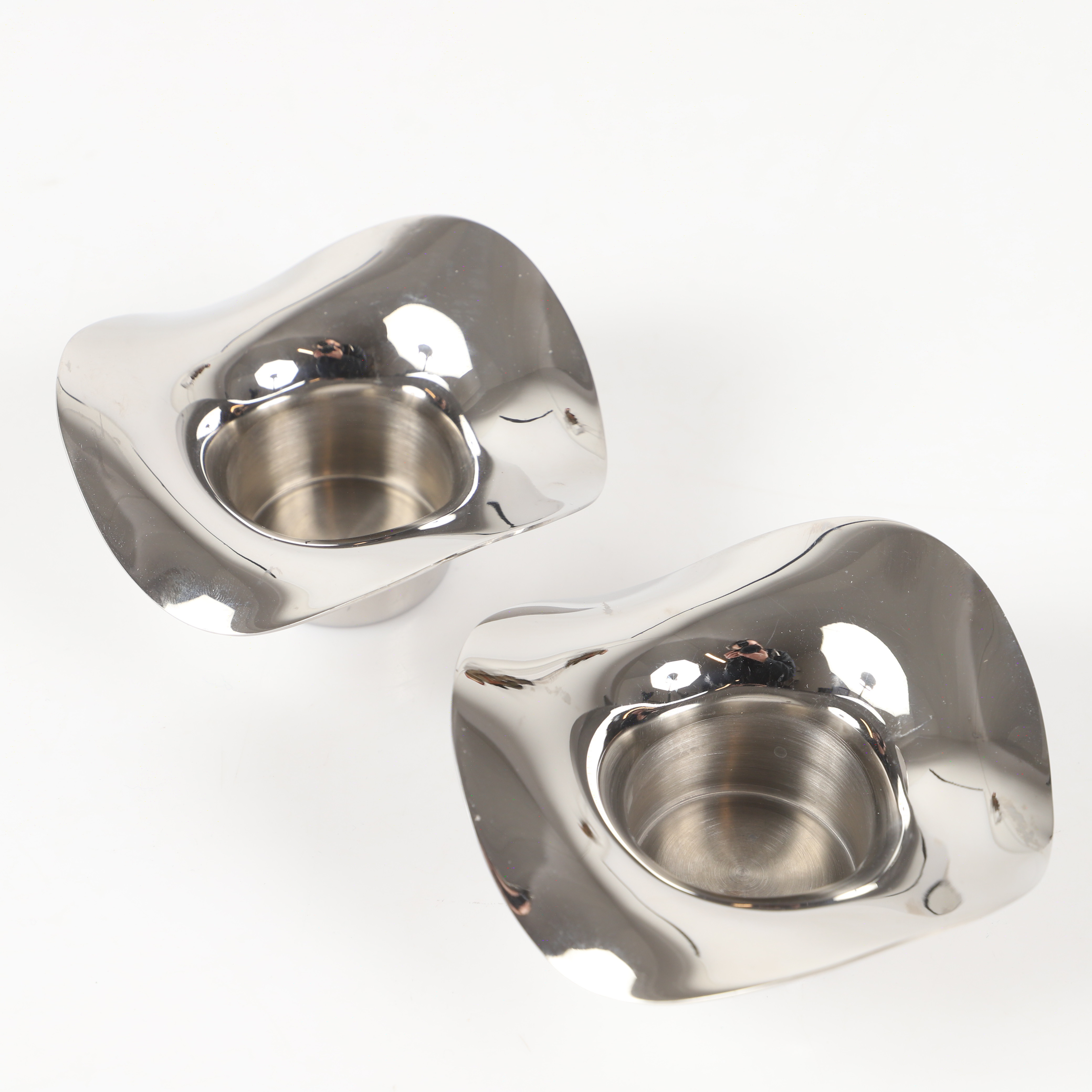 CONSTANTIN WORTMANN. Ljusstakar, 1 par, "Cobra", roistfritt stål, Georg Jensen, Danmark.