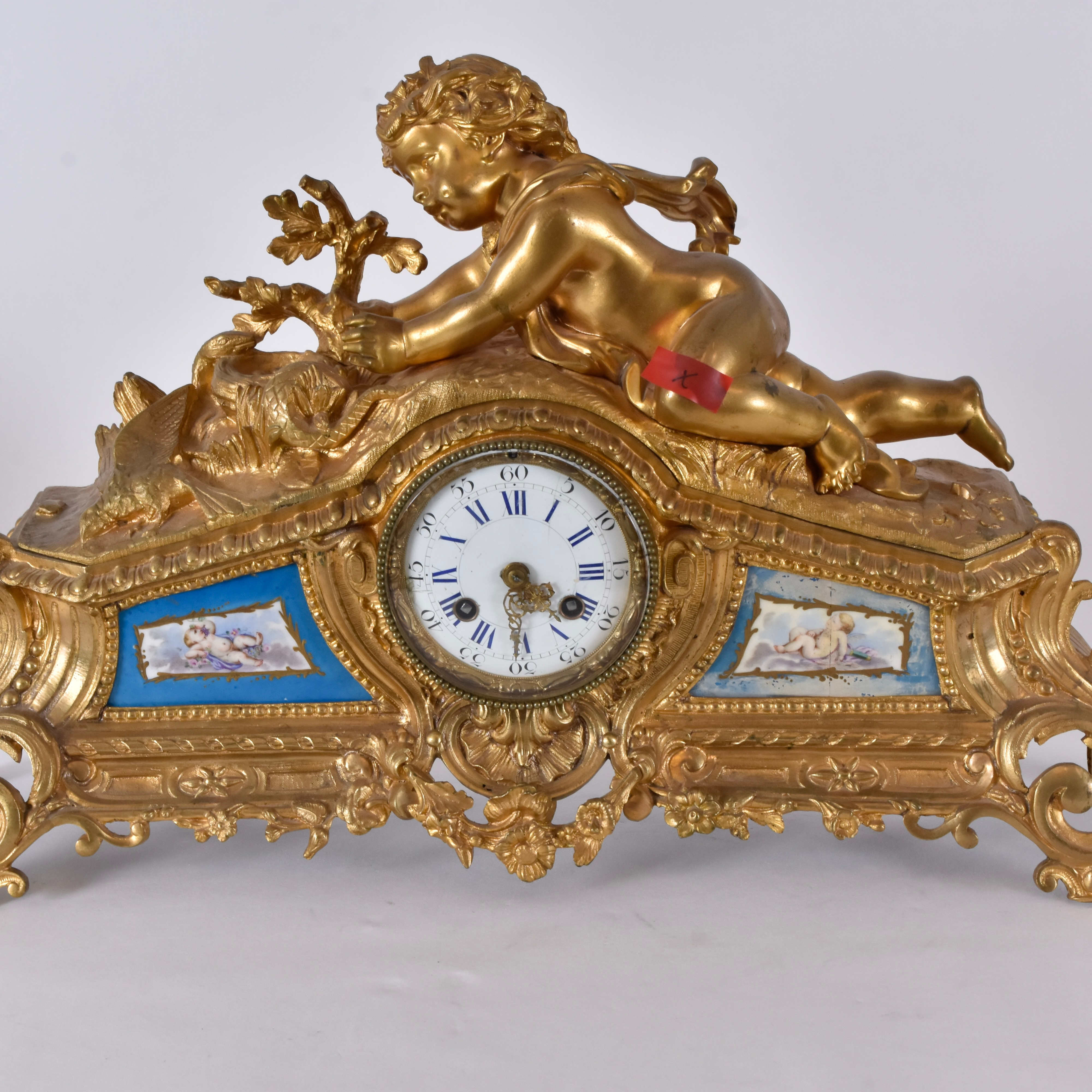 KAMINUR, förgylld metall med infattade porslinsplaketter, Samuel Martí Paris.