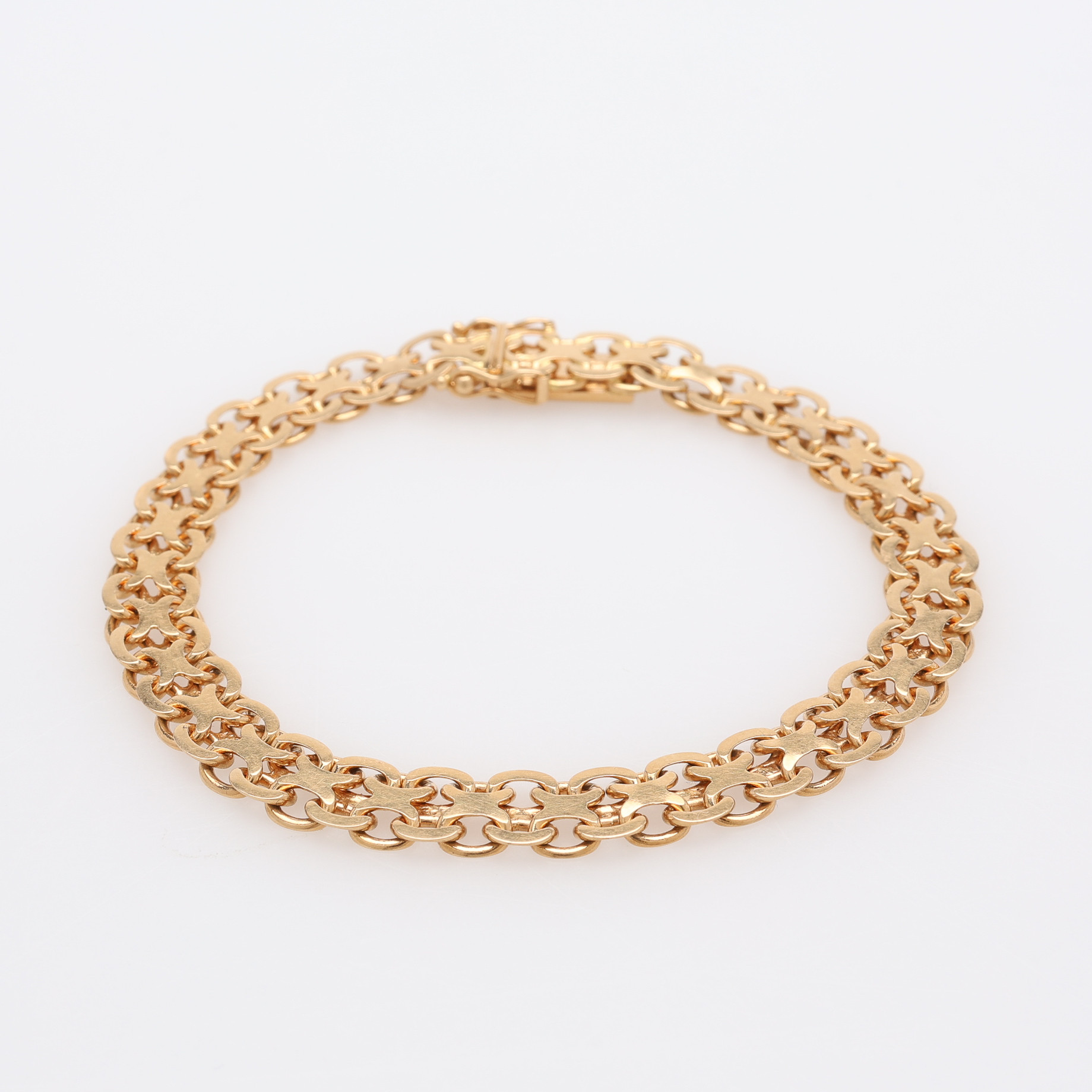 ARMBAND, 18 K GULD, MANGLAD X-LÄNK, 14 g.