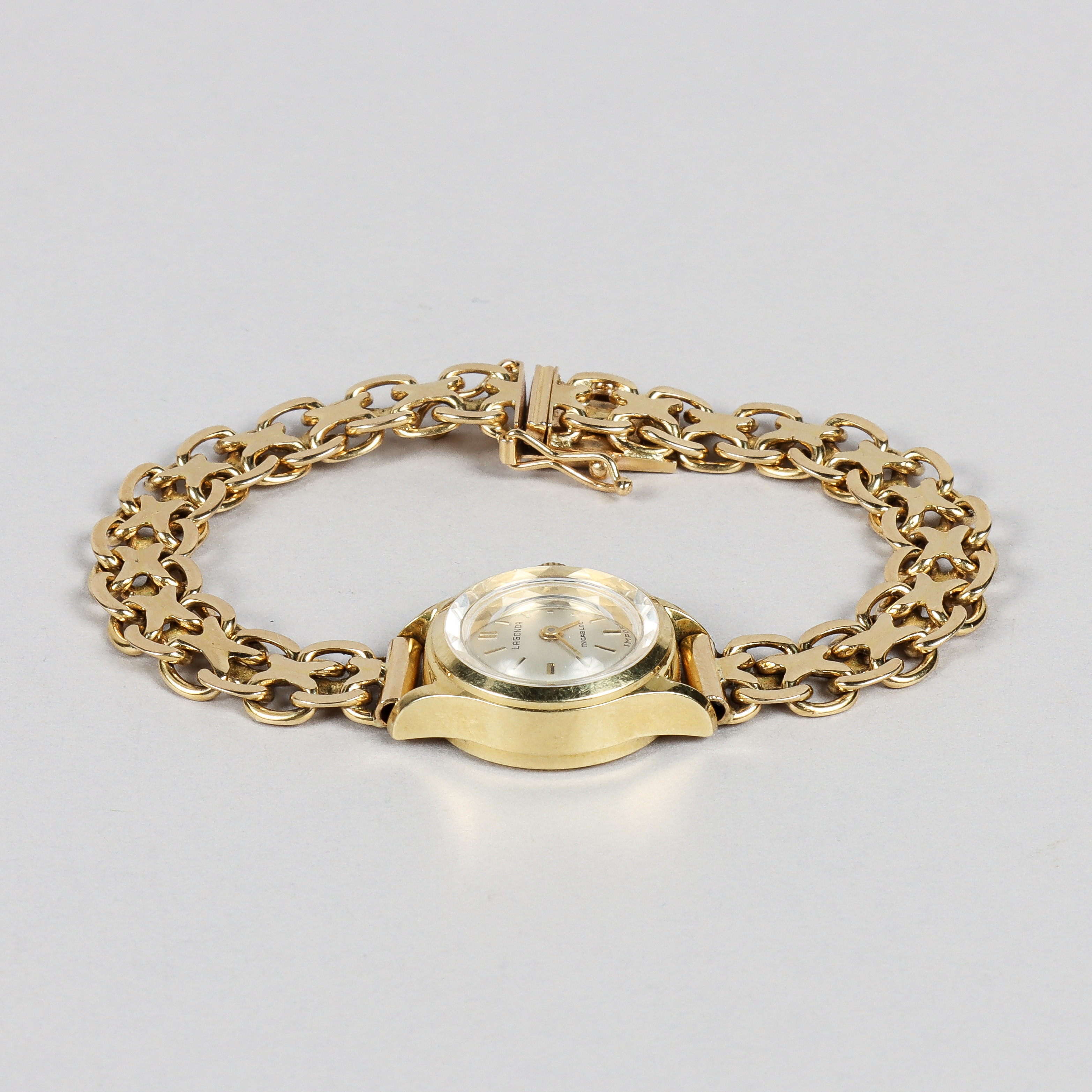 LAGONDA damur, boett och armband i 18k guld, manuell.