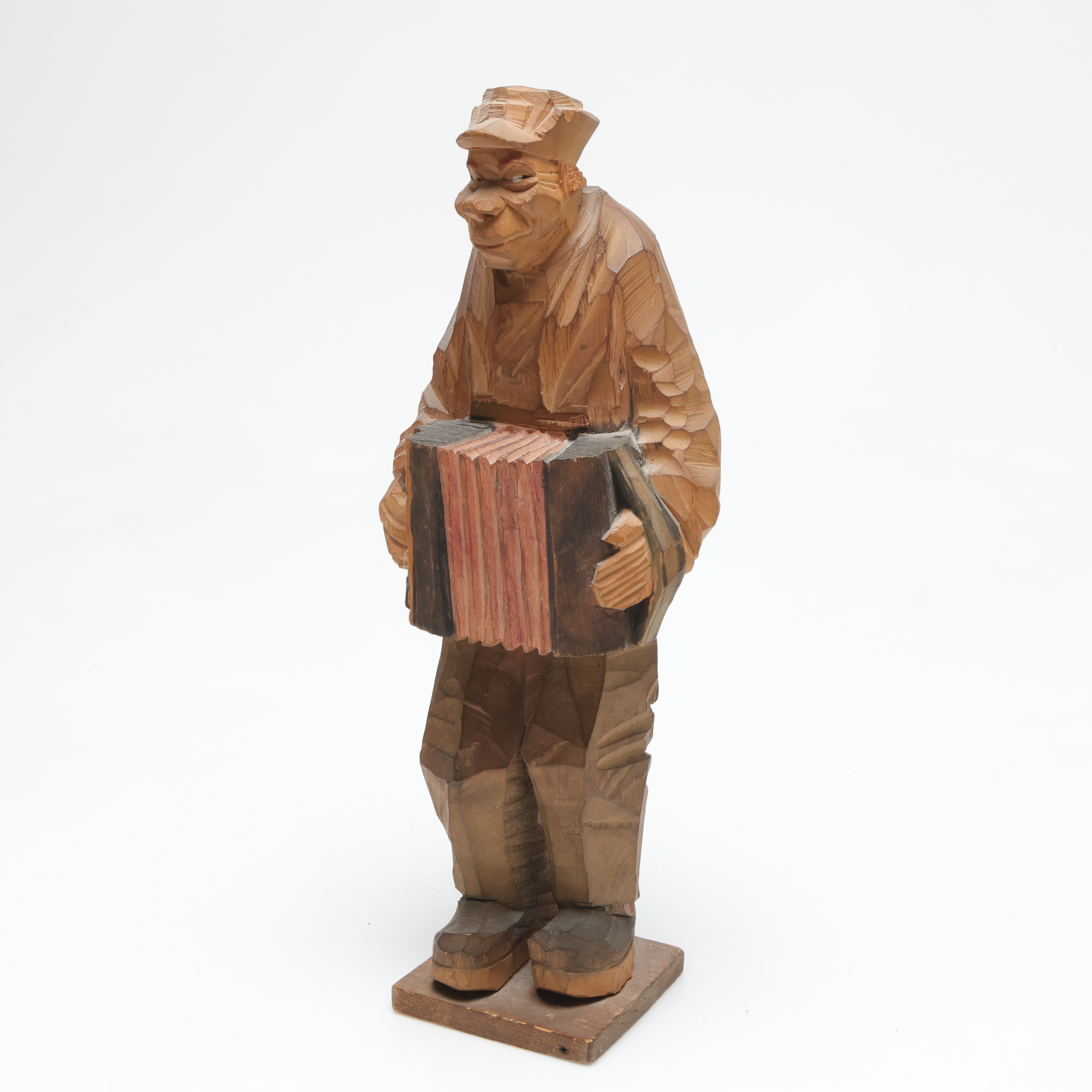 CARL-JOHAN TRYGG. TILLSKRIVEN. Skulptur, dragspelare, otydligt signerad.