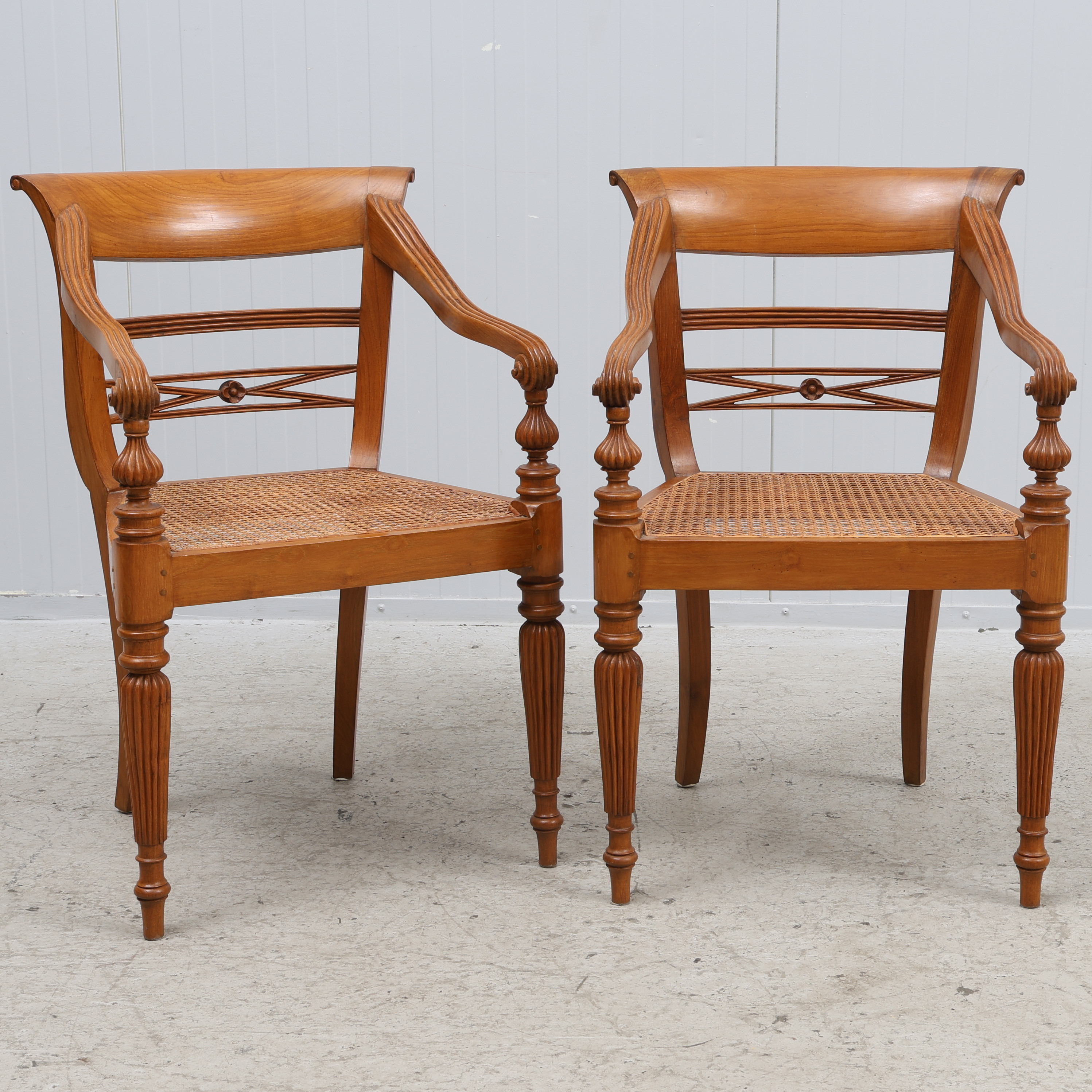 KARMSTOLAR, ett par, trä med rottingsits, 1900-talets första hälft.