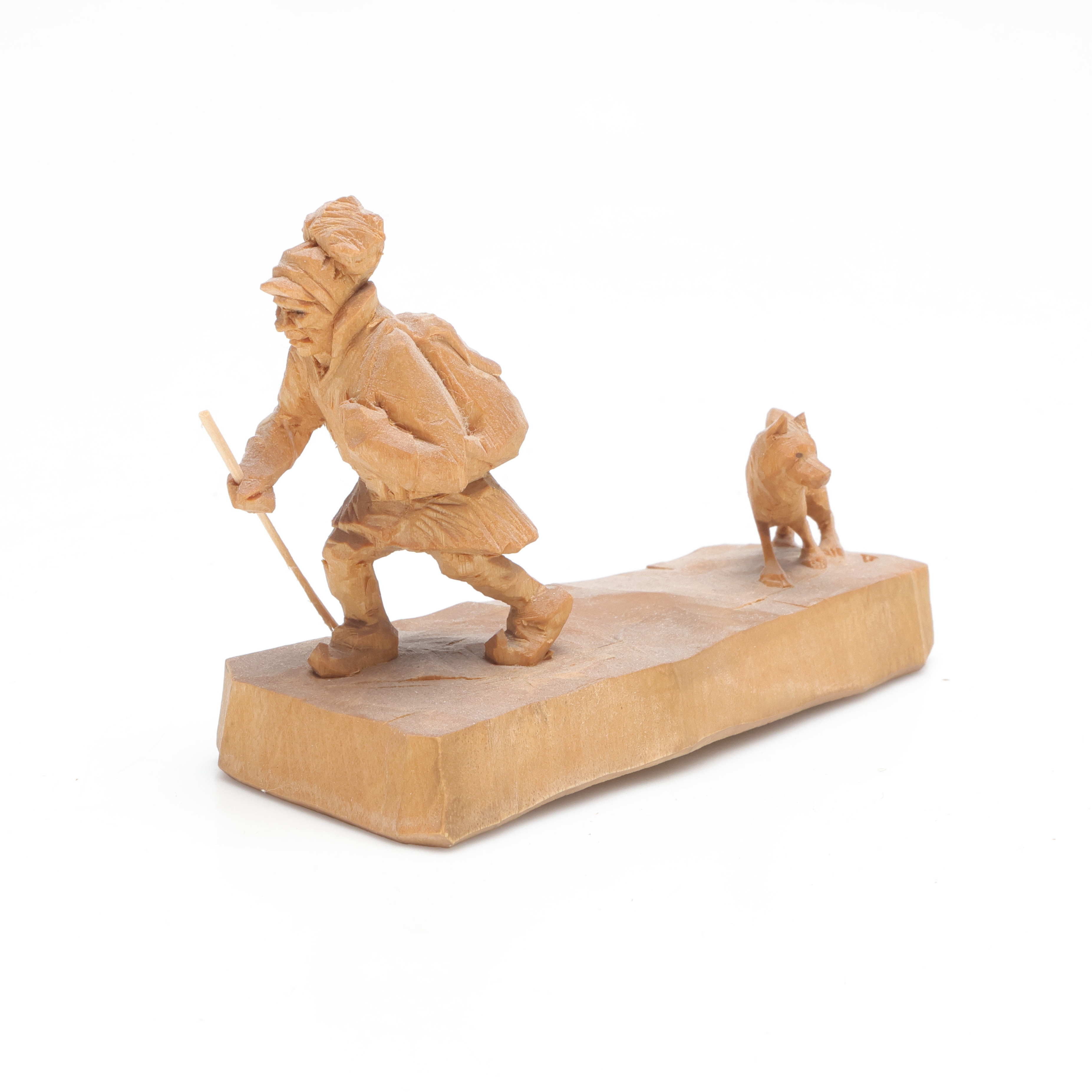 MARTIN STENSTRÖM (1912-2001). skulptur, föreställande vandrande same med hund, skuret trä, monogramsignerad M.S.