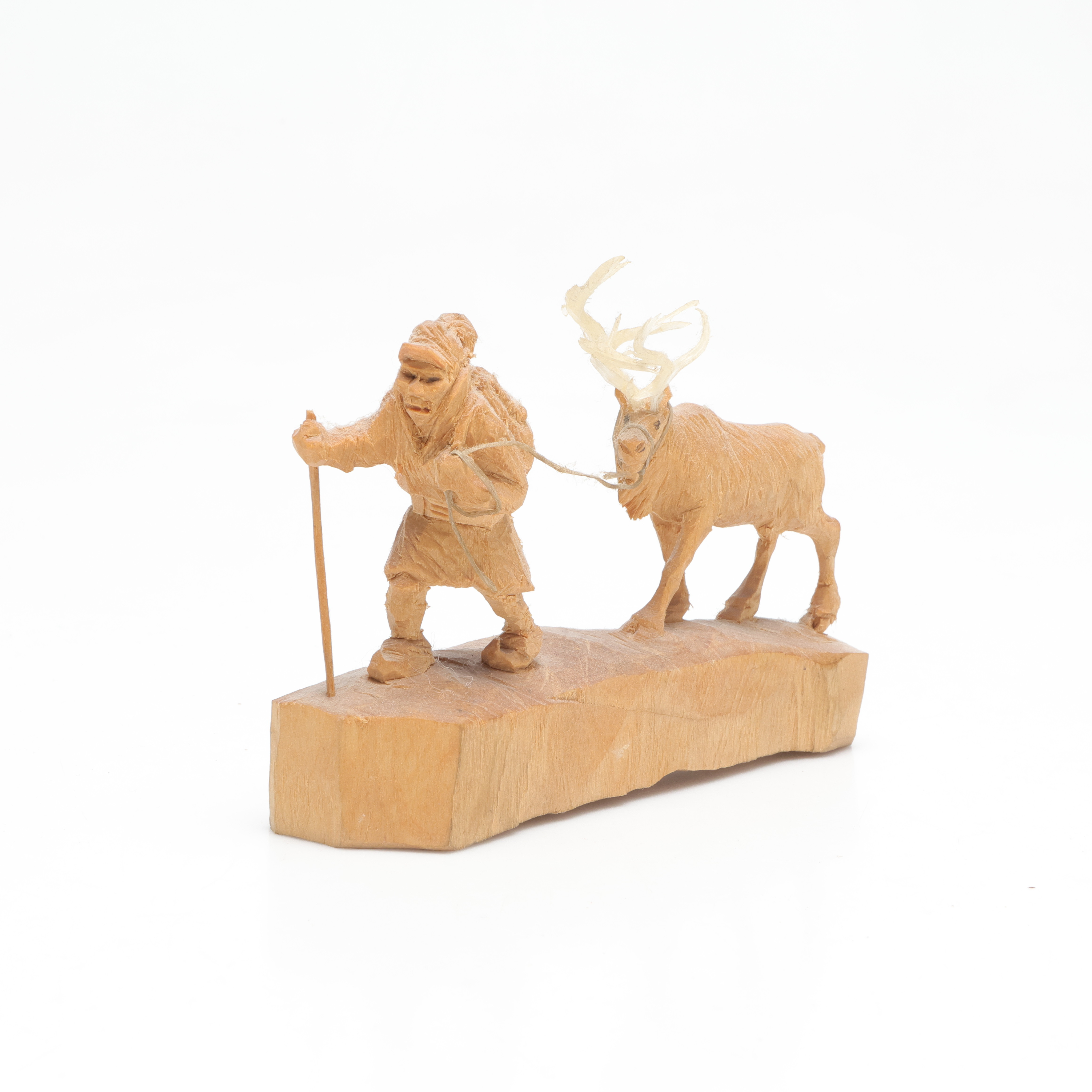 MARTIN STENSTRÖM (1912-2001). skulptur, föreställande vandrande same med ren, skuret trä, monogramsignerad M.S.