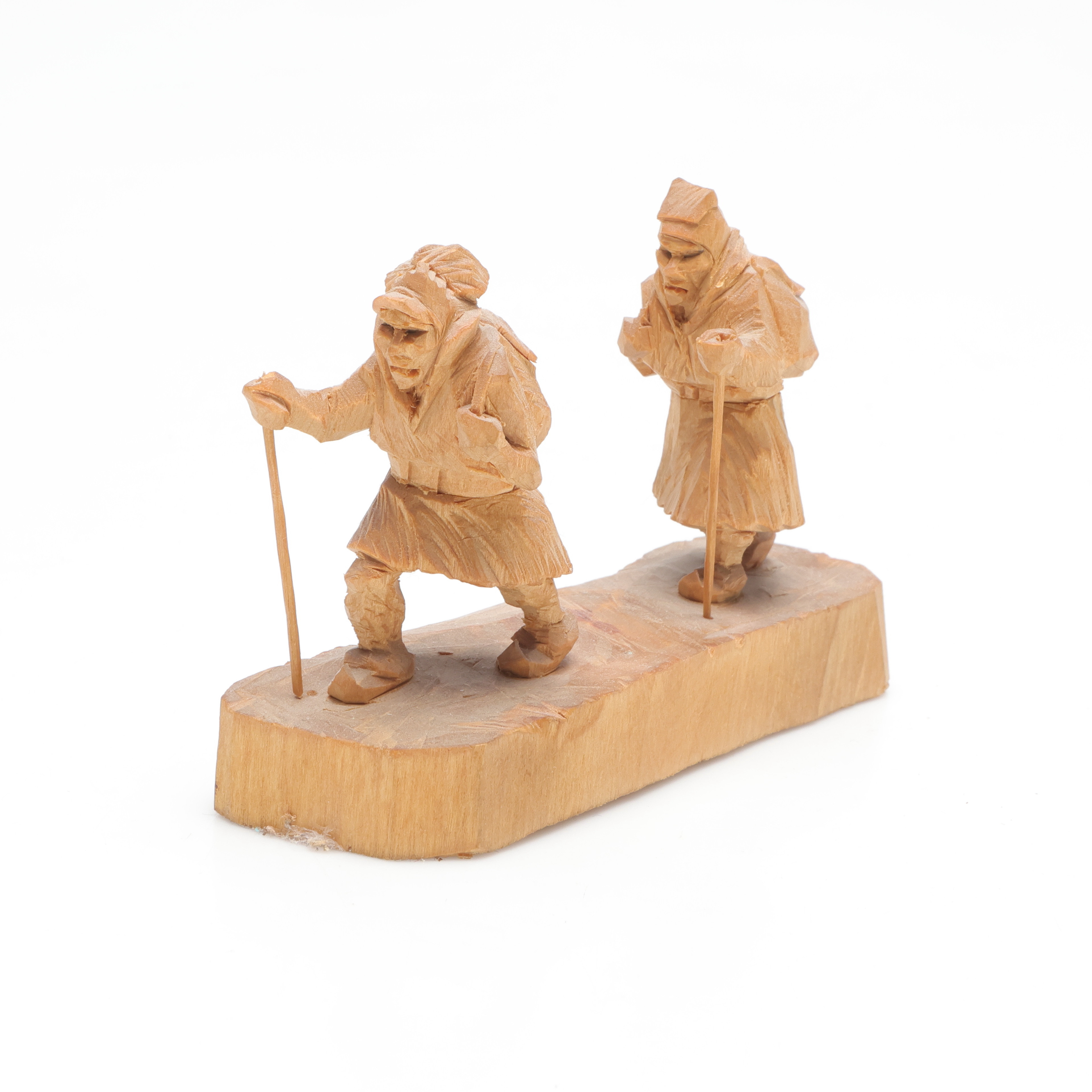 MARTIN STENSTRÖM (1912-2001). skulptur, föreställande vandrande samer, skuret trä, monogramsignerad M.S.