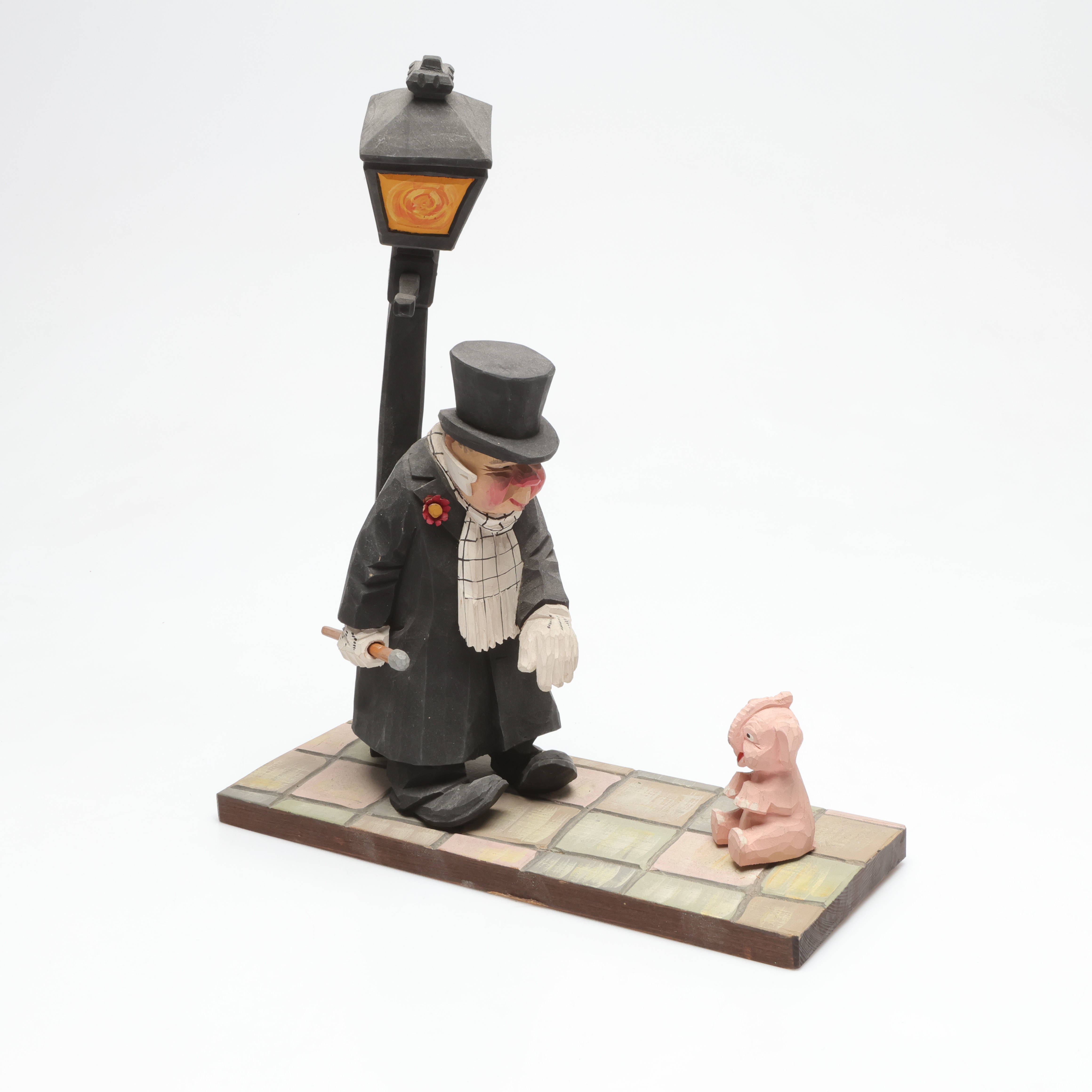 CARL OLOF TRYGG. skulptur. man med elefant, skuret och bemålat trä.