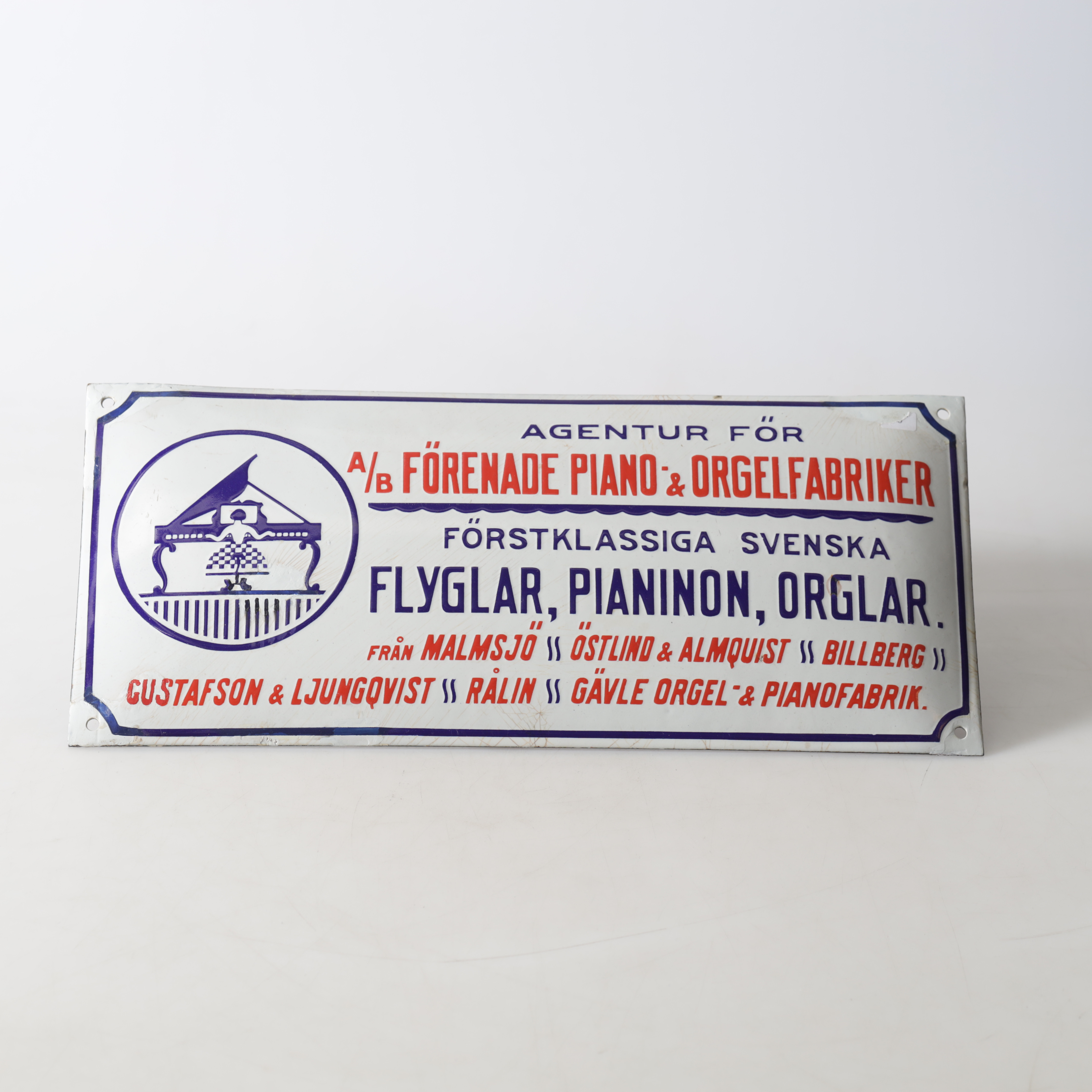 EMALJSKYLT. "AB förenade piano & oregelfabriker" 1900-tal.