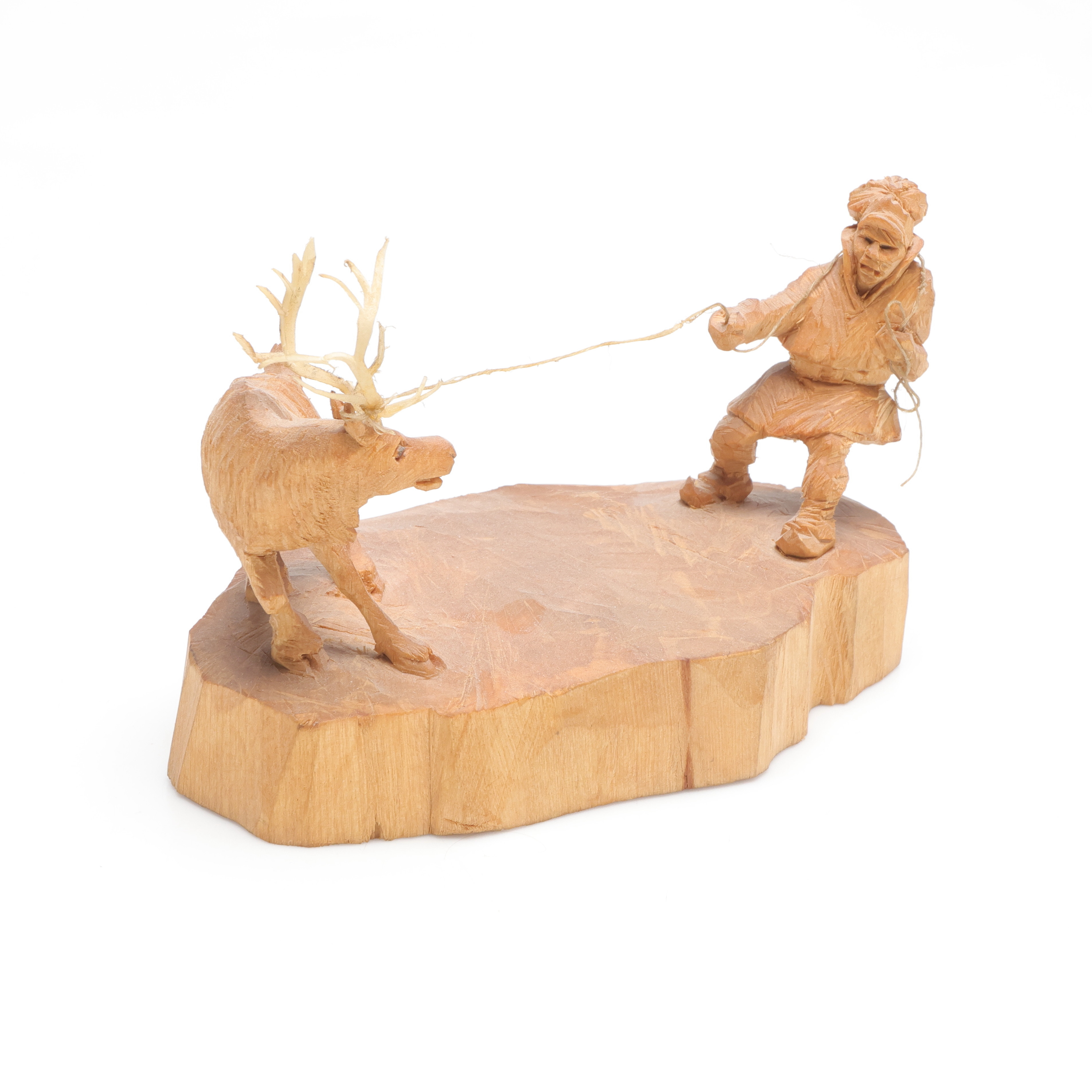 MARTIN STENSTRÖM (1912-2001). skulptur, föreställande same som fångar ren, skuret trä, monogramsignerad M.S.