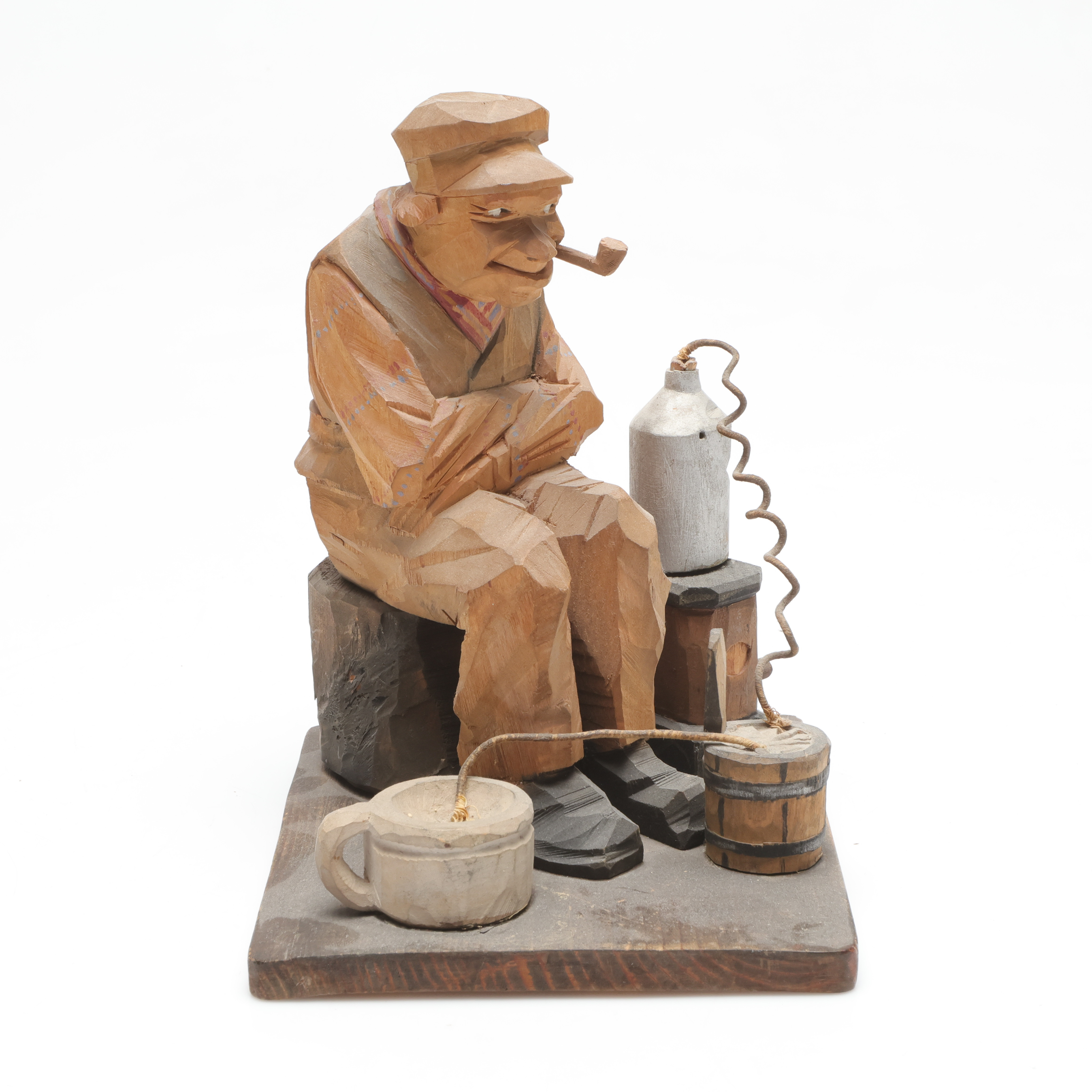 CARL JOHAN TRYGG. skulptur, "Hembrännare", snidat trä, signerad och daterad 1923.