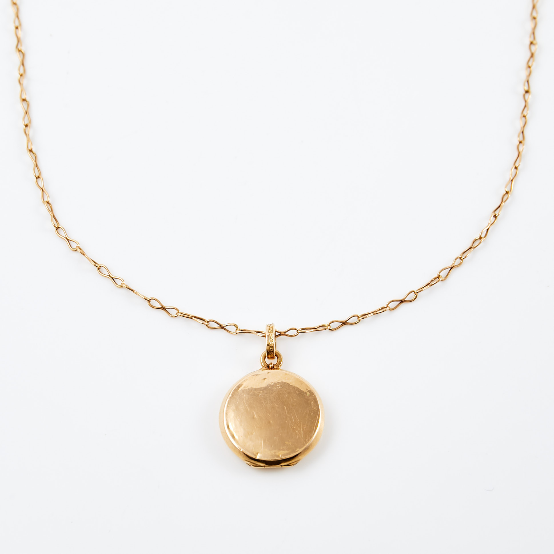 HALSBAND, 18 k guld, fantasilänk, medaljong med fotogömma, 1900-talets första hälft.