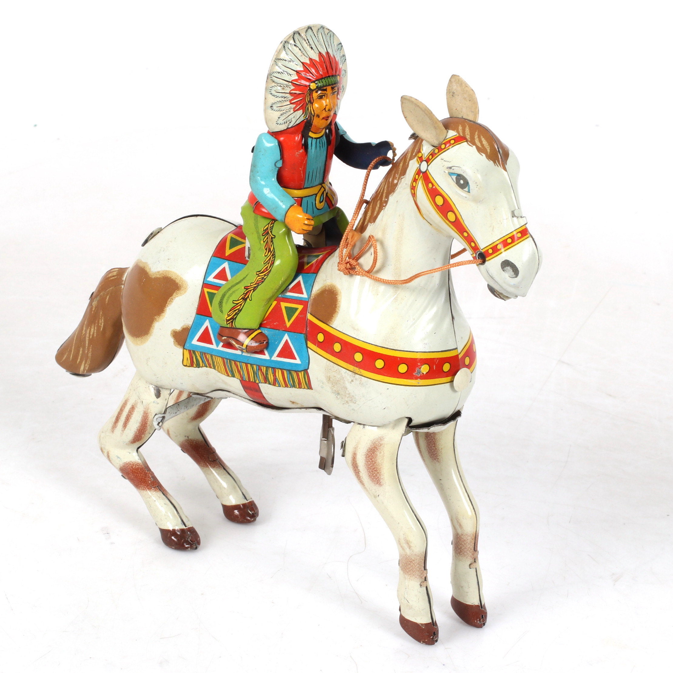 PLÅTLEKSAK, Indian till häst, urverk, 1900-talets andra hälft.