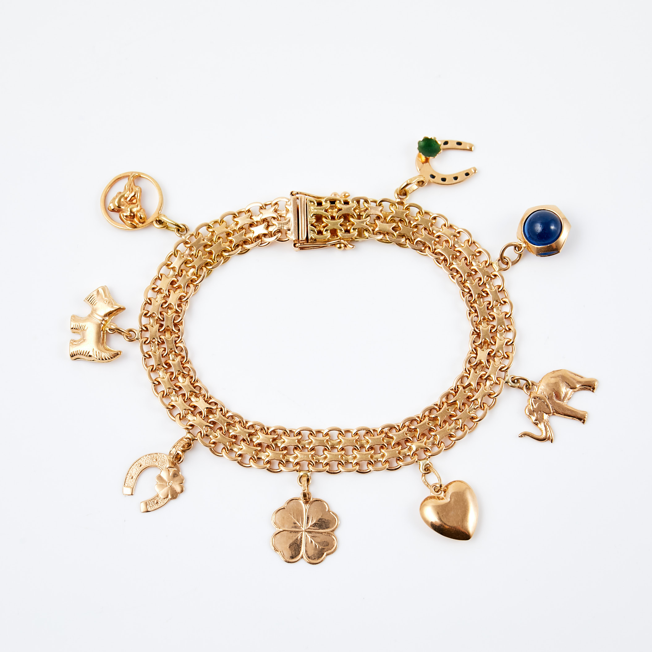 ARMBAND, 18 k guld, x-länk, dekor av 8 berlocker, blått glas, emalj, Ahlms Guld Och Silververkstad, Stockholm, 1958.