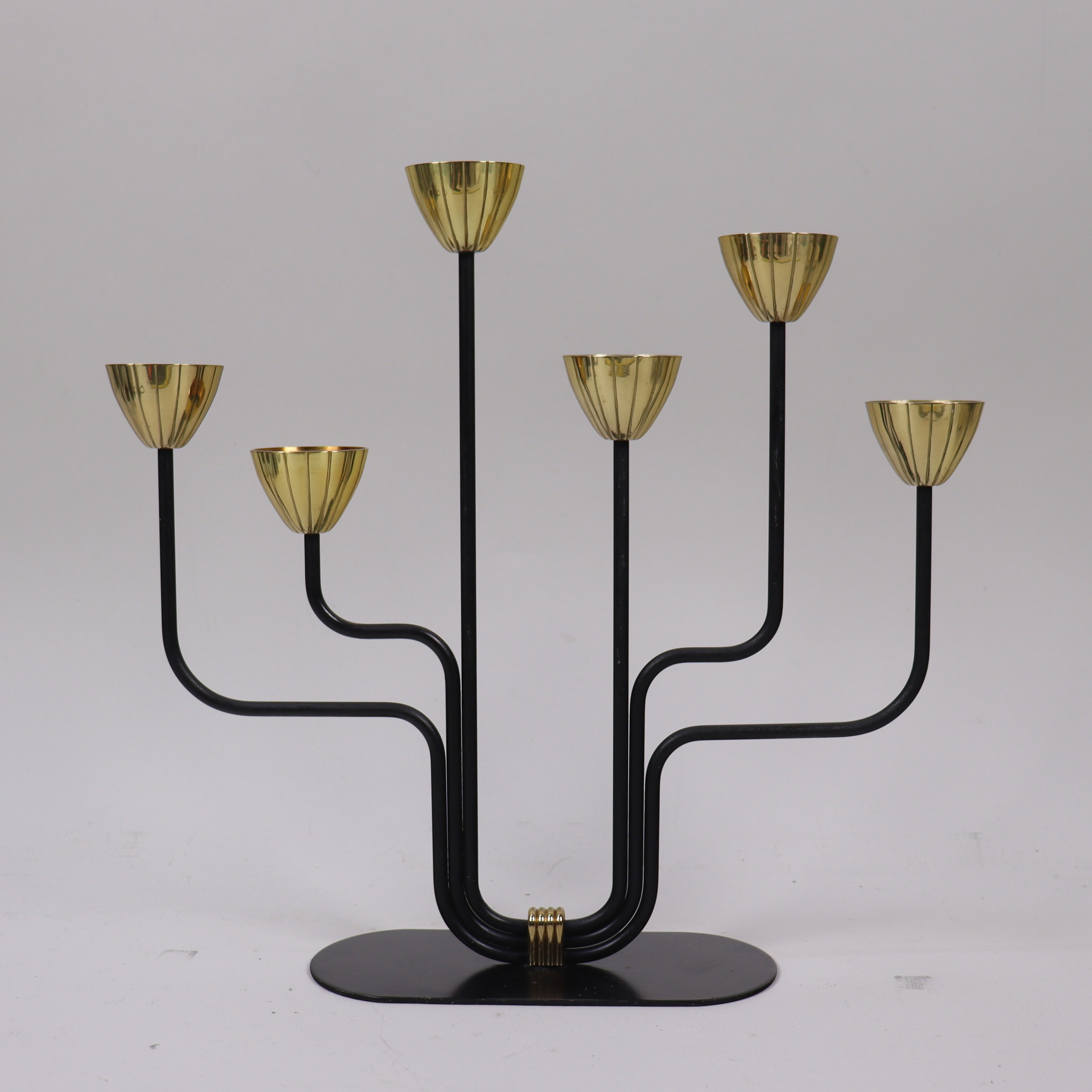 GUNNAR ANDER. Ystad Metall, ljusstake i smide och mässing, 6 ljushållare.