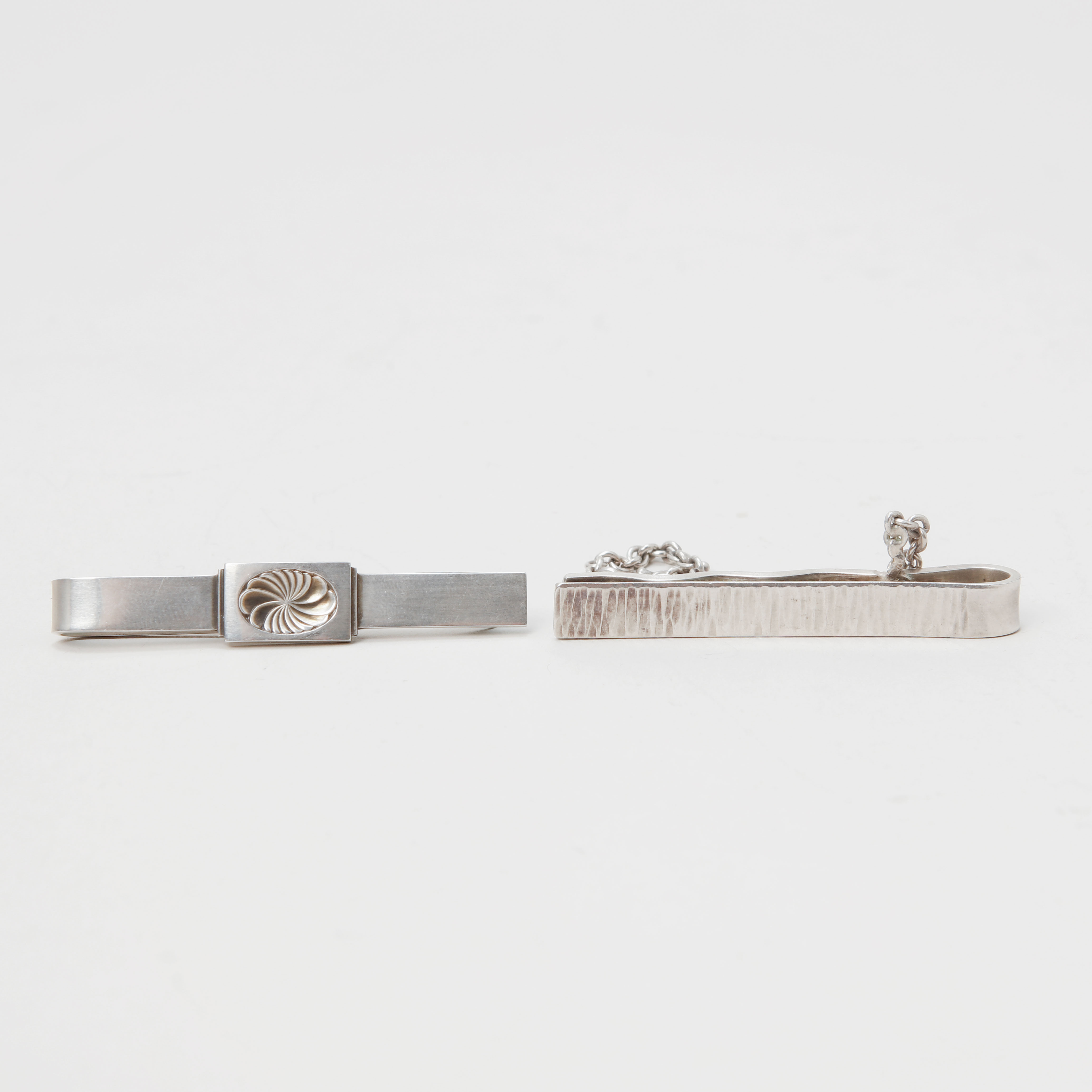 SLIPSNÅLAR, 2 stycken, silver, bland annat Georg Jensen.